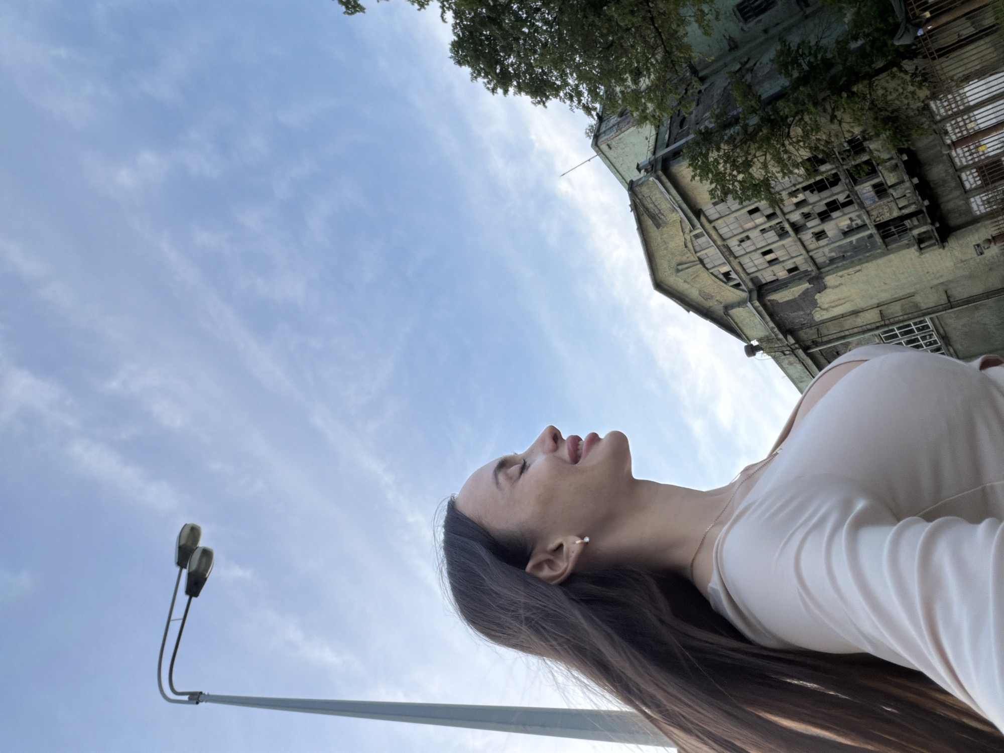 Woman photographed during riverside portrait session in Saint Petersburg