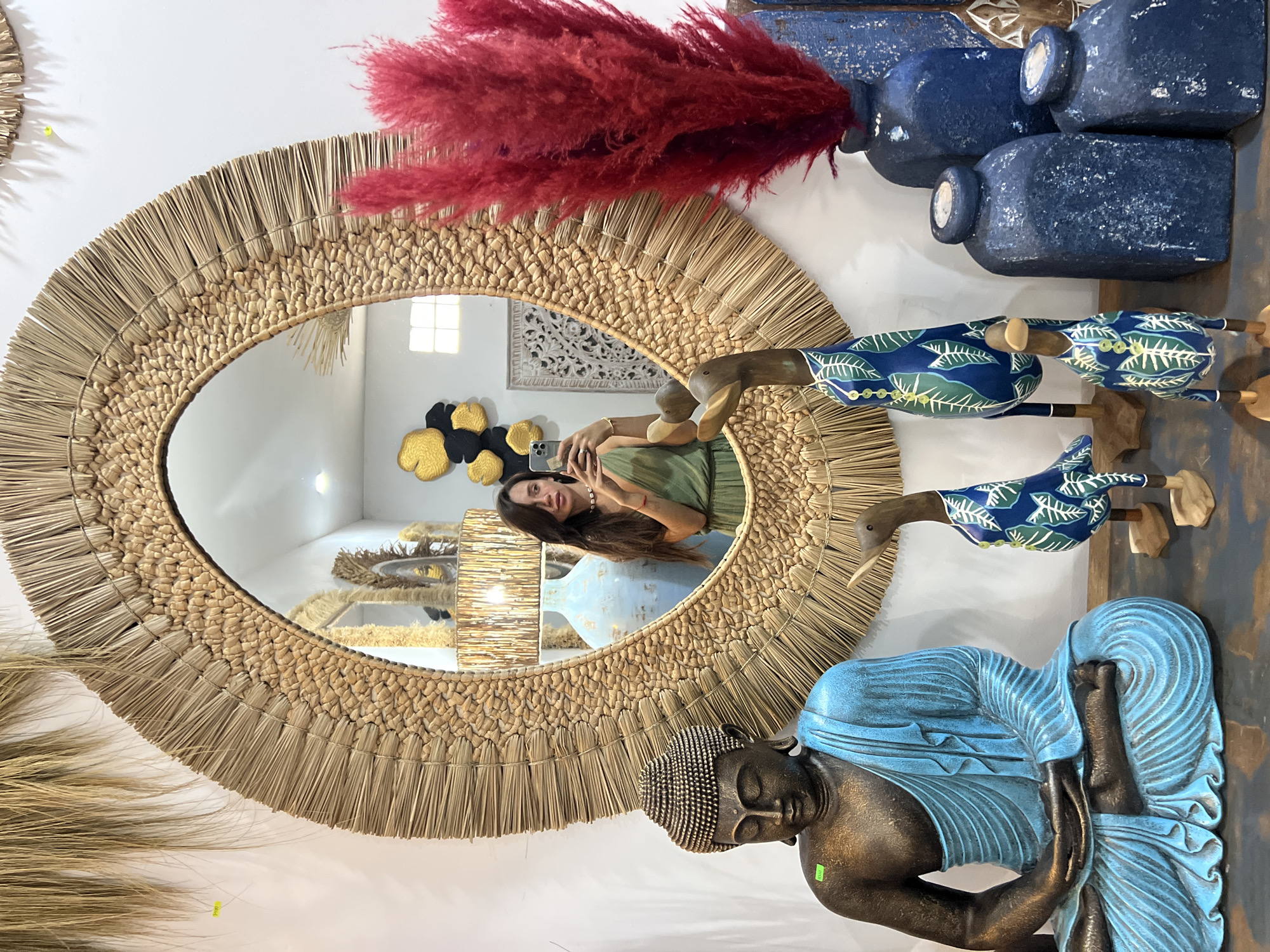 Woman takes mirror selfie, carnations spotted in early morning