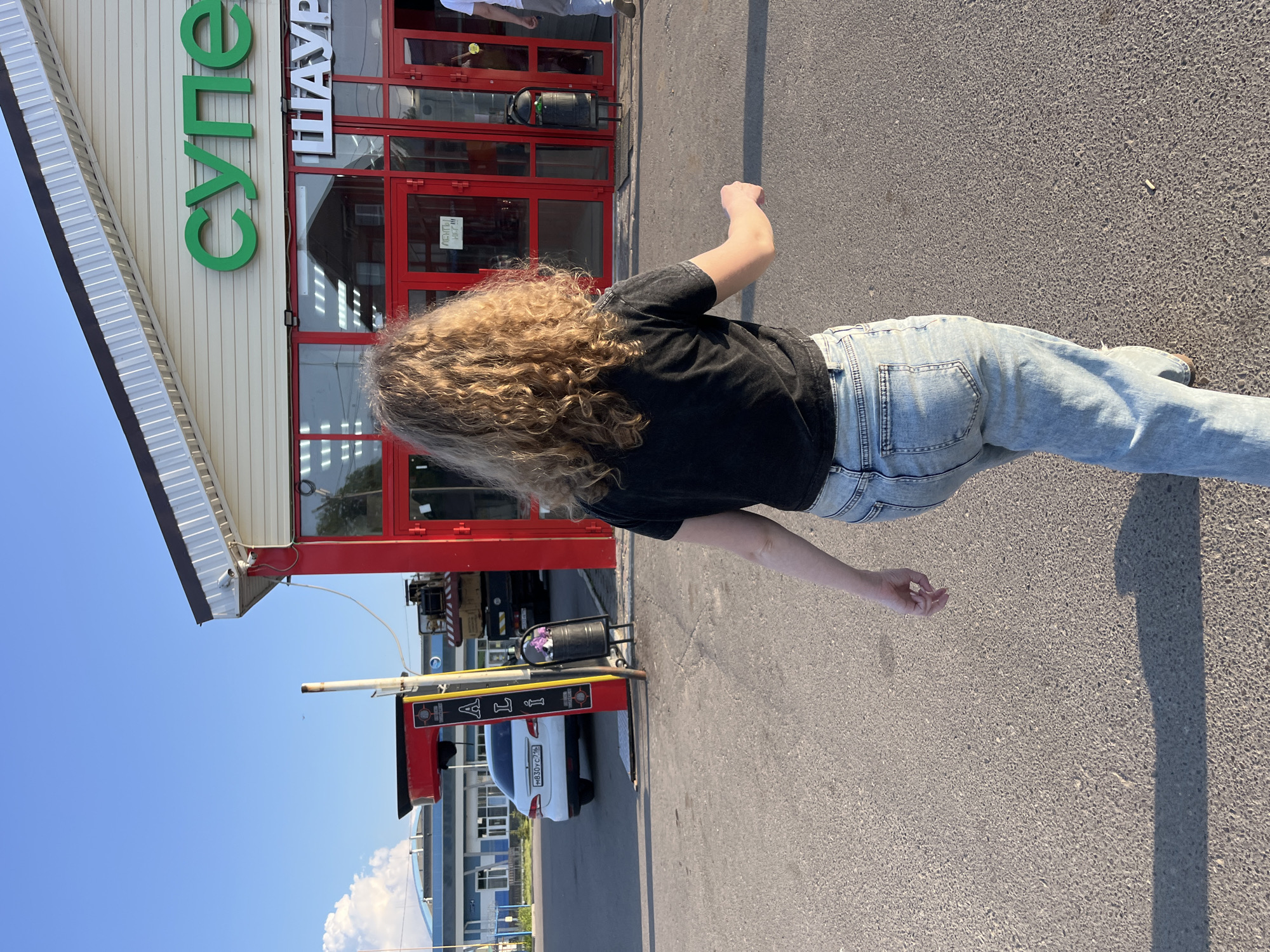 Walking toward red building in Vasilyevo, Russia