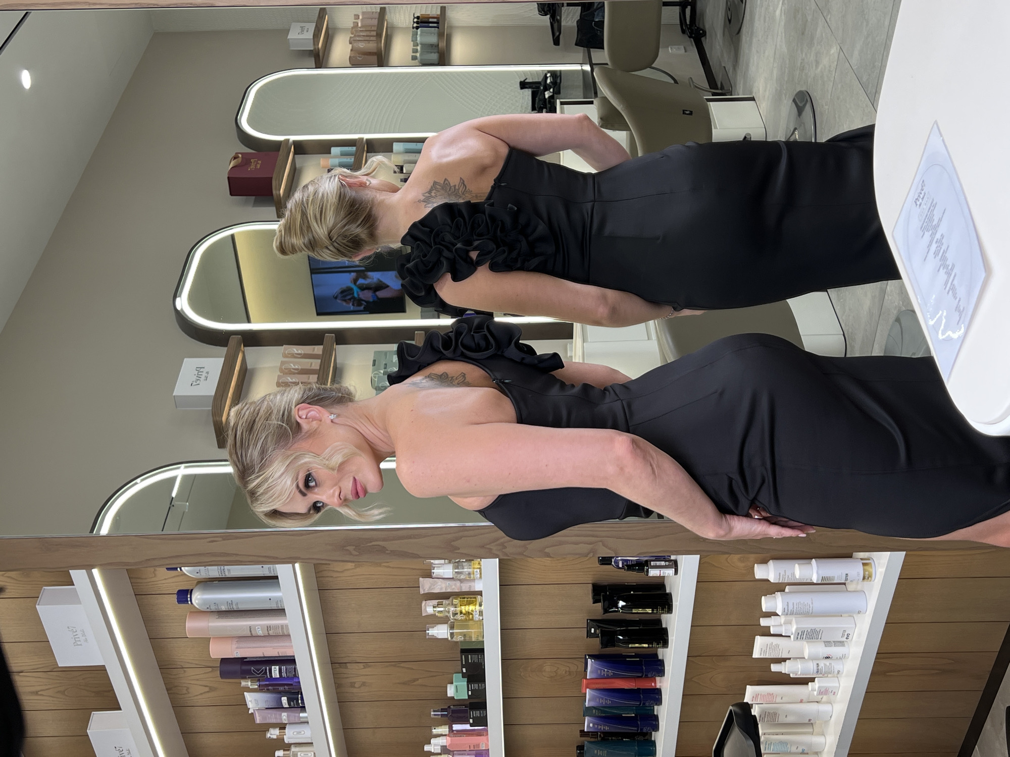 Inside an Abu Dhabi salon, a ruffled dress and updo steal the frame