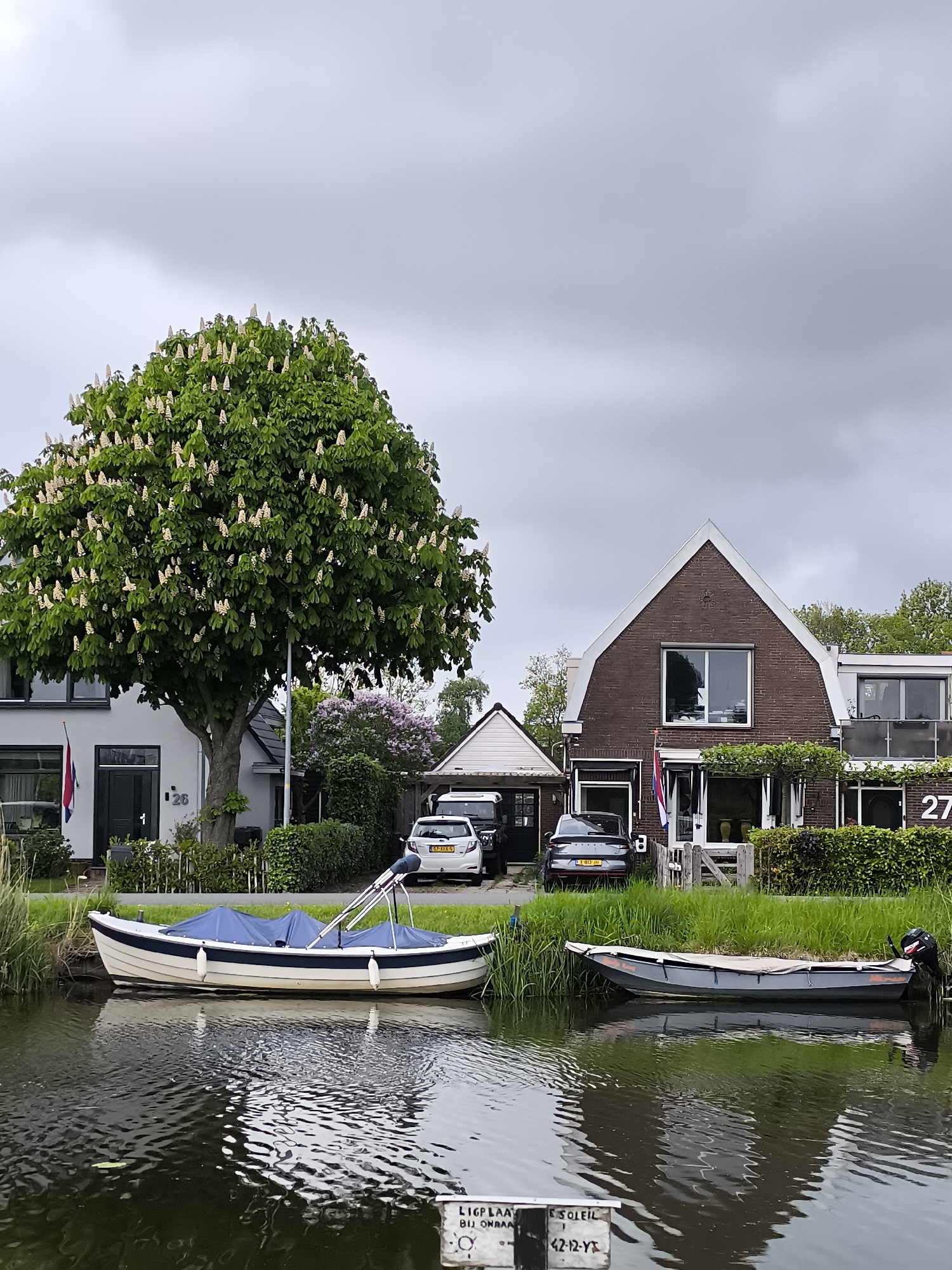 Canal boats and art sculpture documented in Netherlands region
