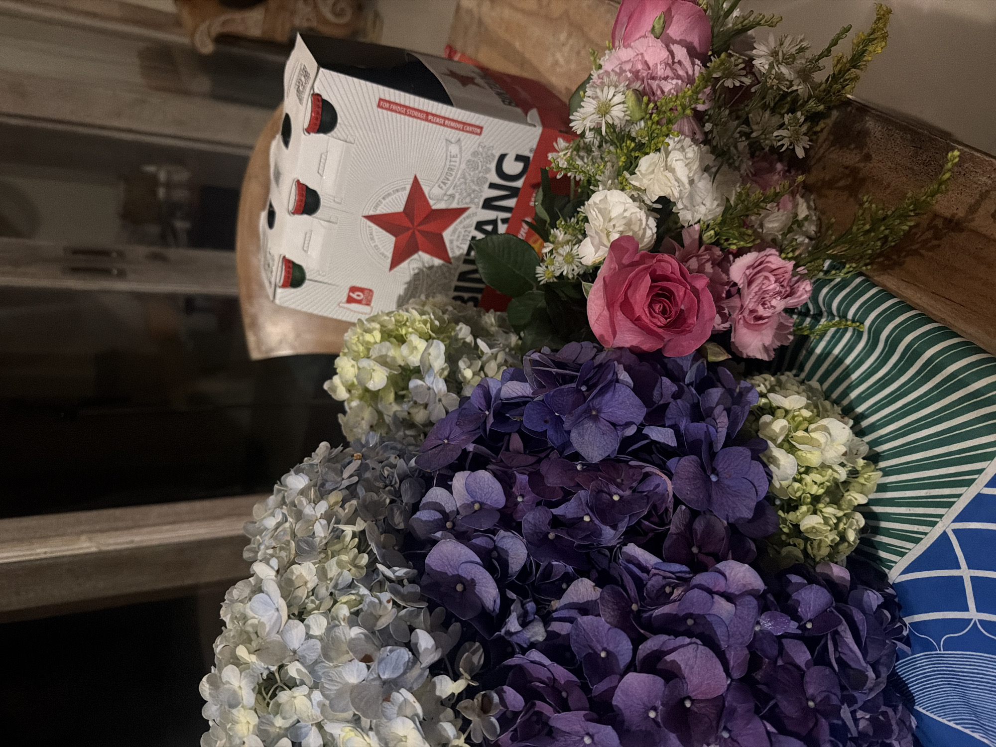 Bintang beer carton photographed with flowers in Ubud