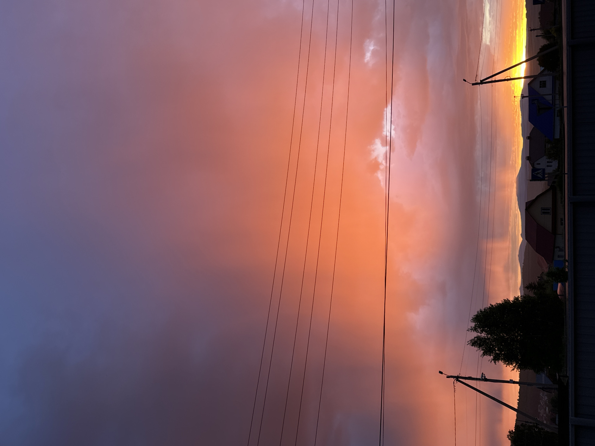 Witness documents vibrant sunset over rural landscape June 1st