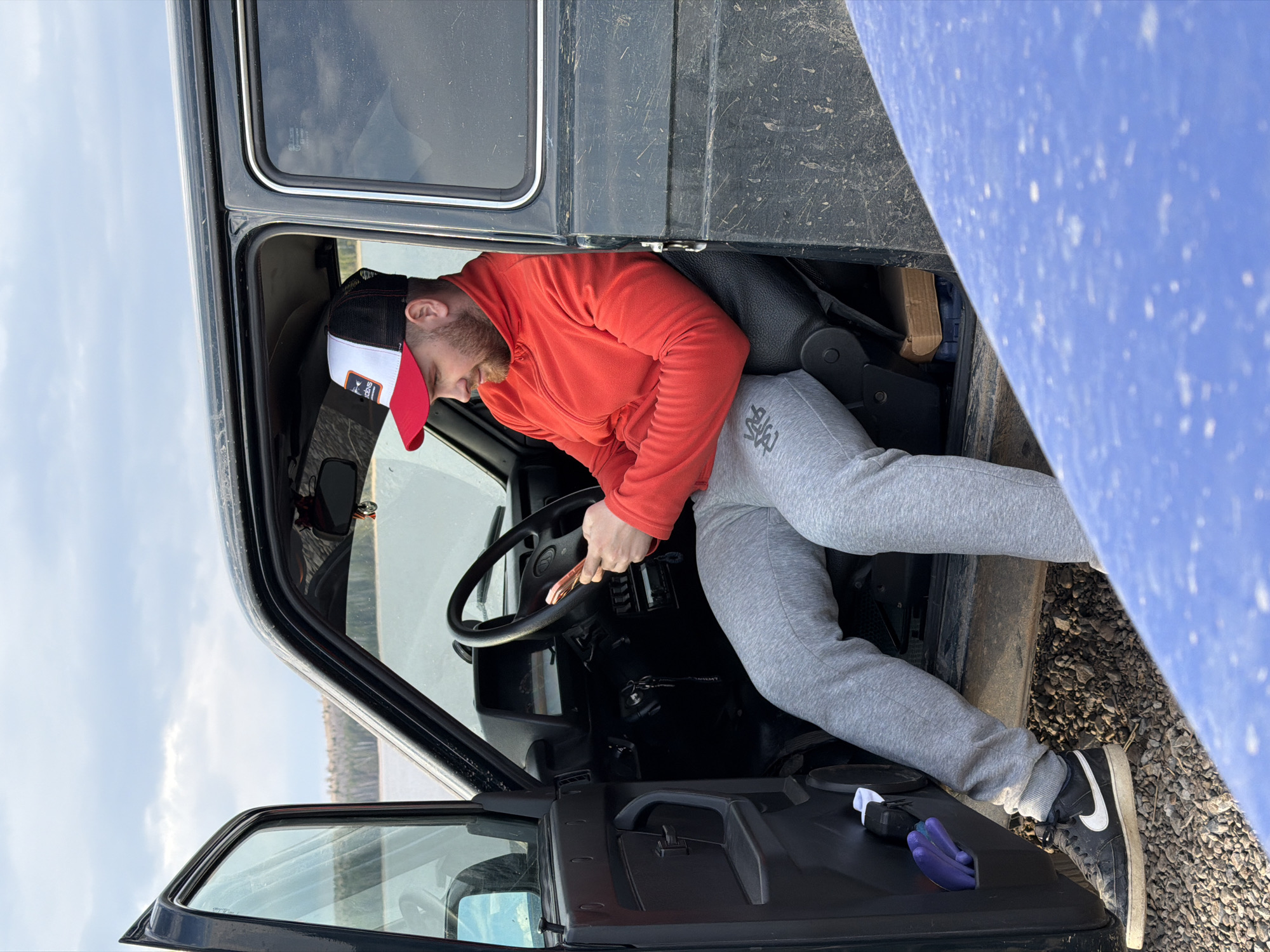 Casual moments captured in Chaikovsky: man in vehicle, fish in lake