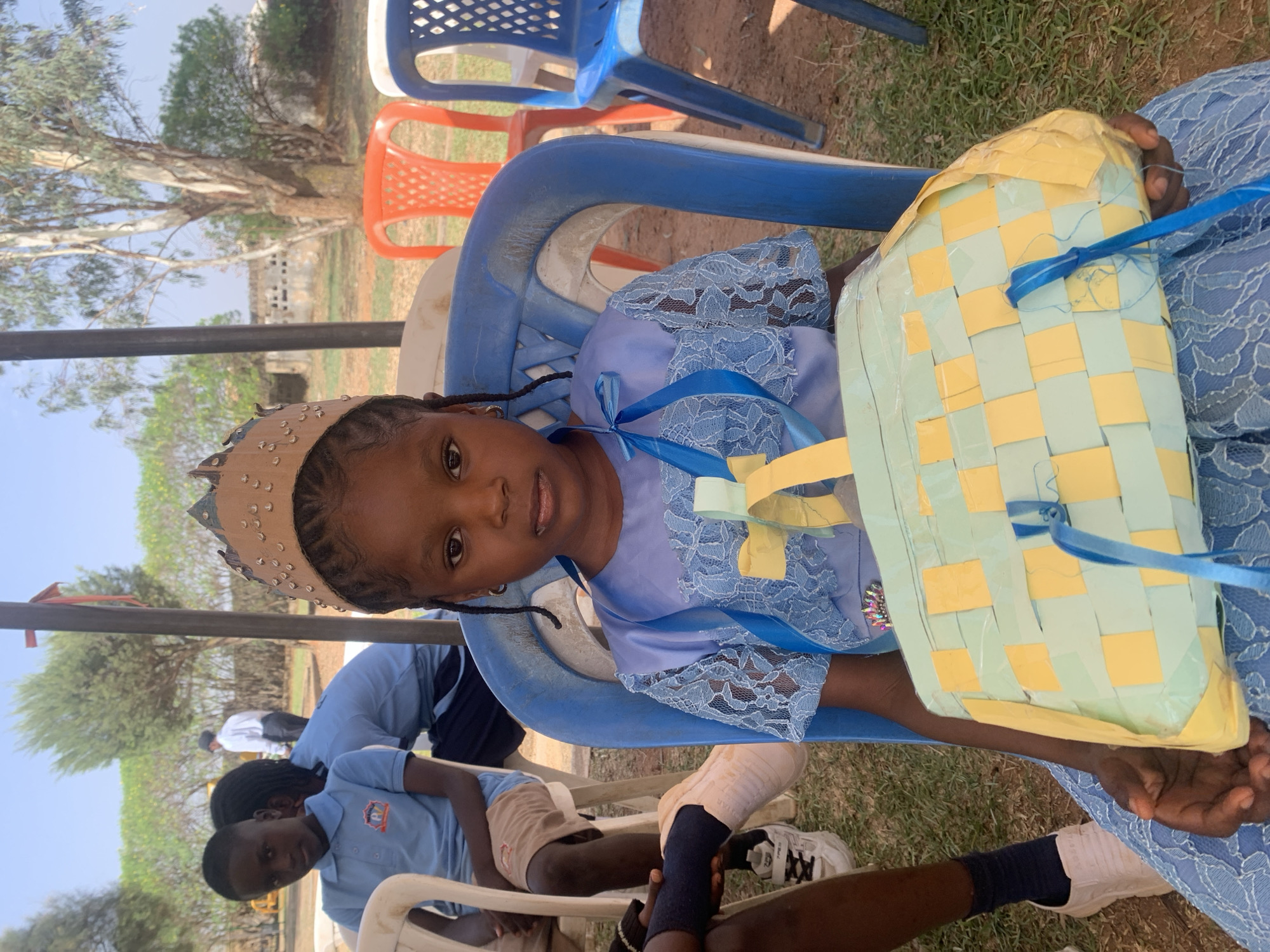 School gathering under tent in Jos, Nigeria Friday morning