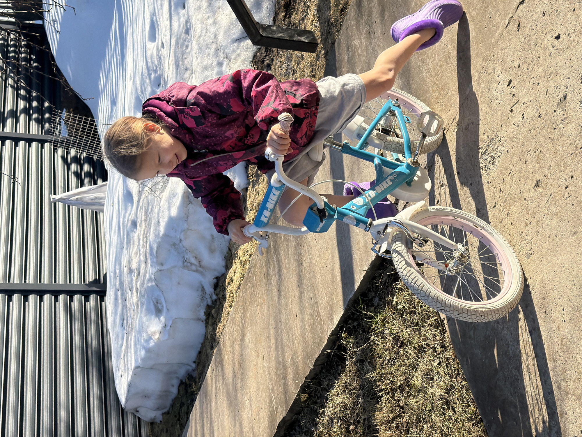Child rides bicycle in Markovo, Russia