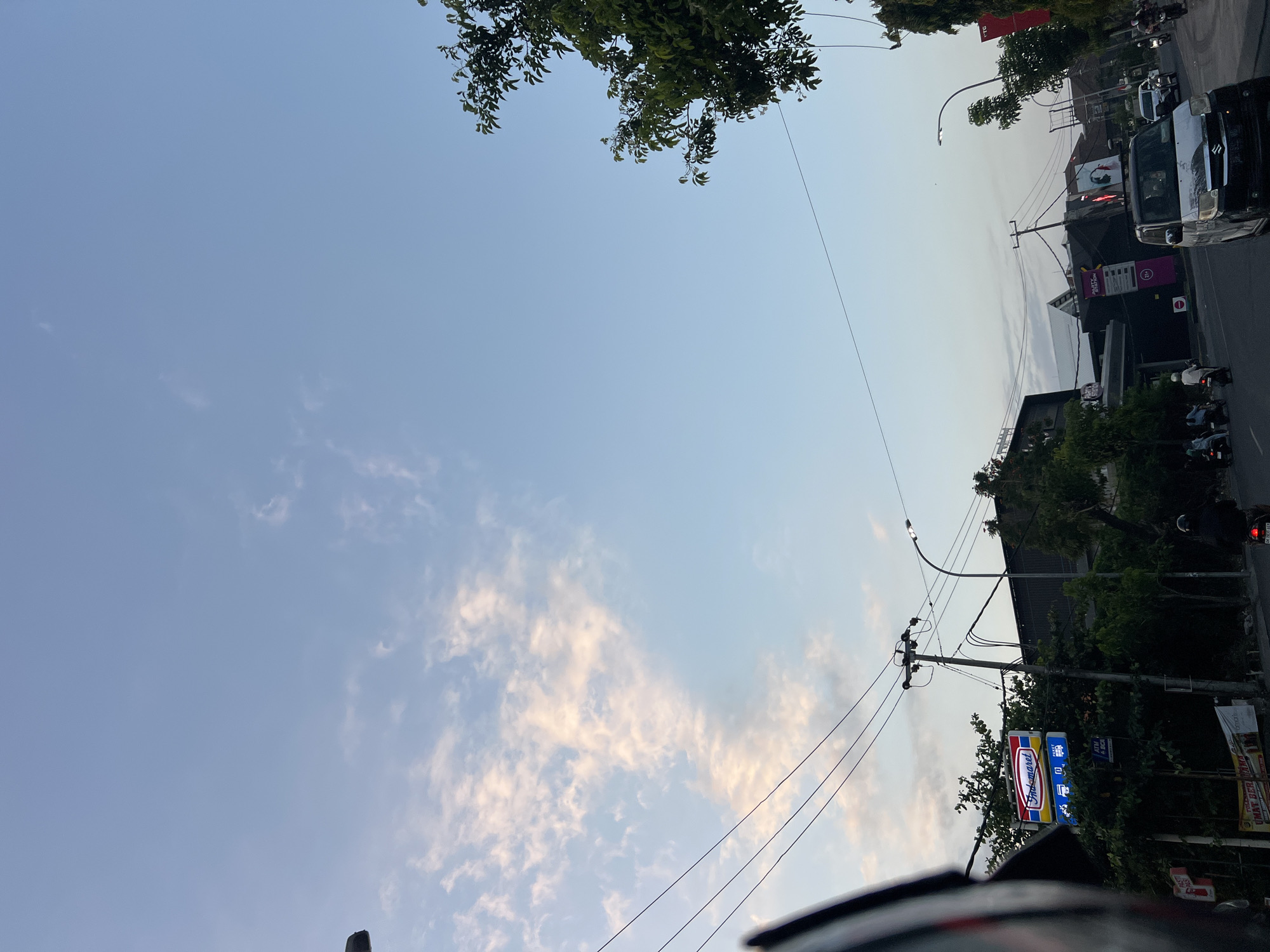 Riding through Kuta traffic as afternoon fades to dusk
