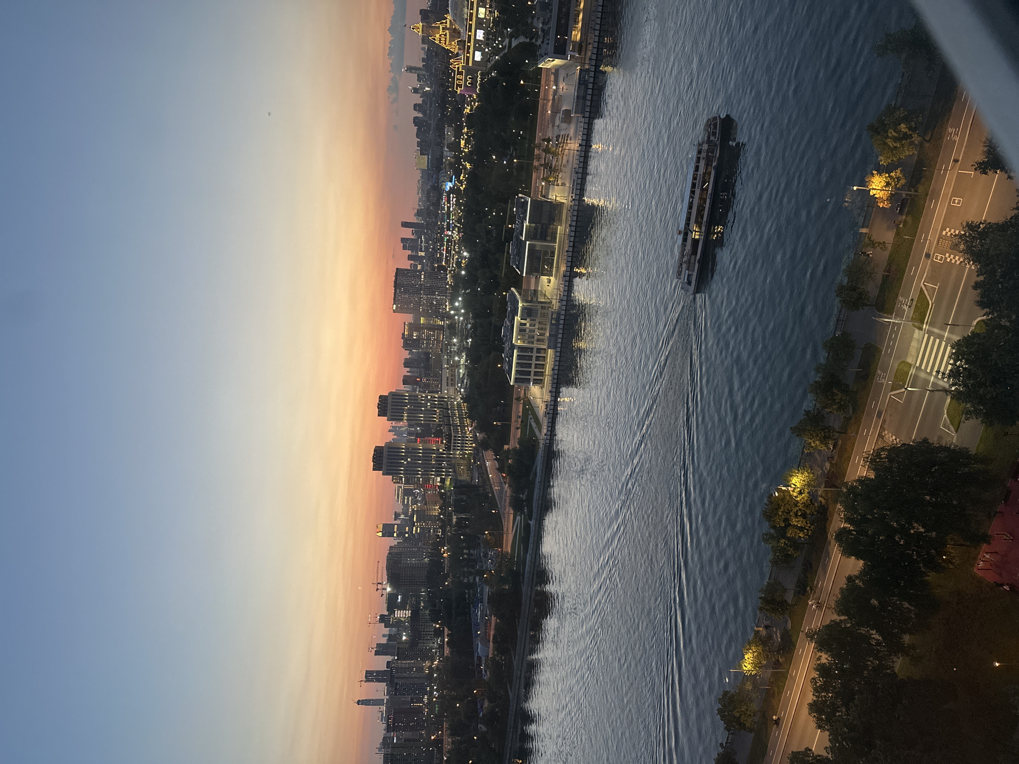 Moscow skyline glows at dusk over the river
