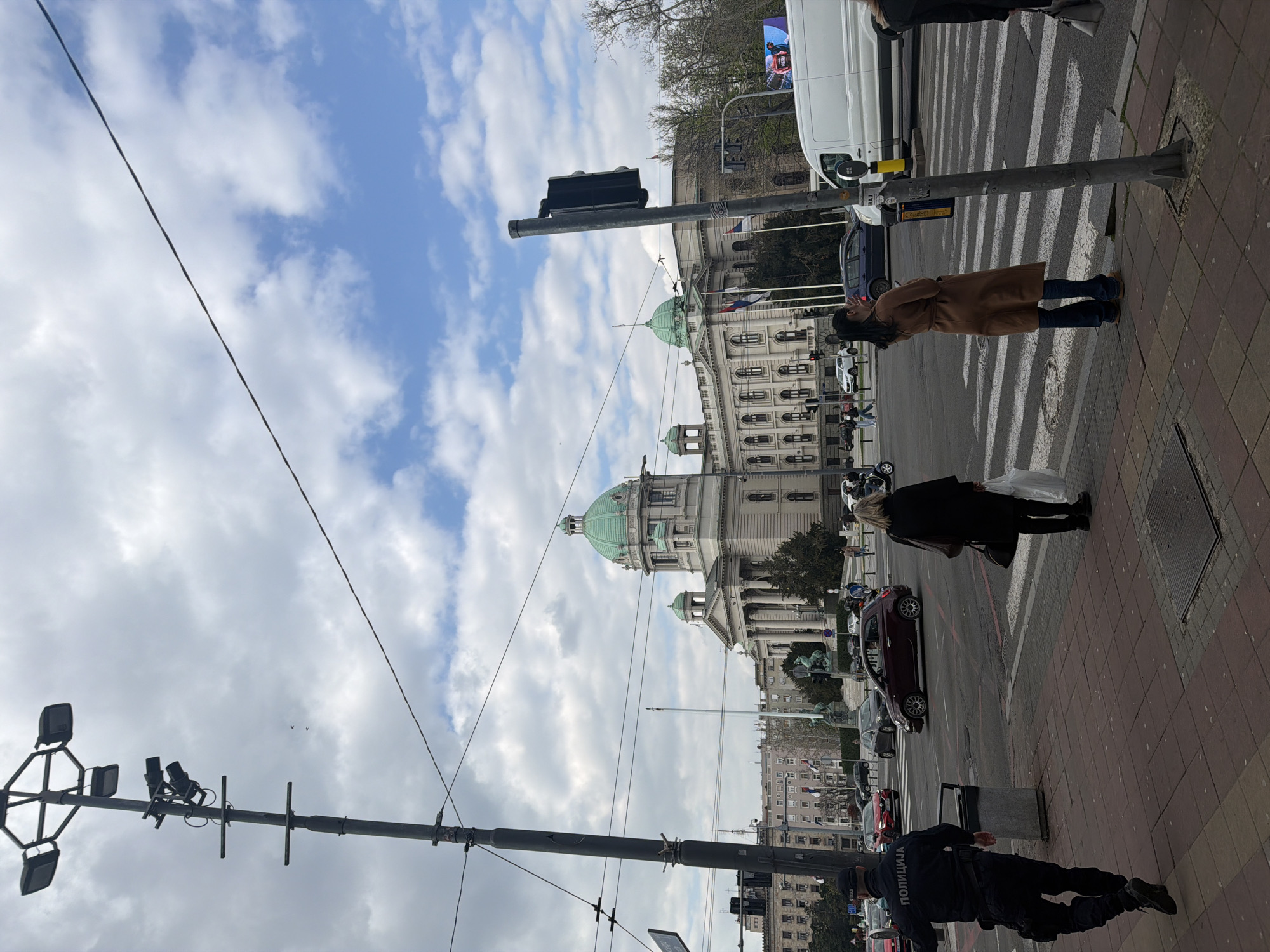 Everyday street scene captured near Serbian Parliament building