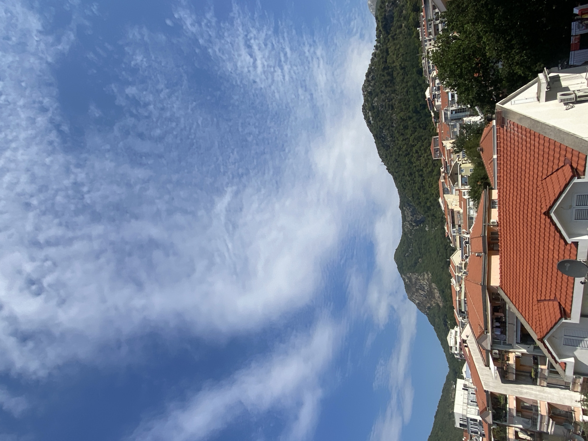 Budva's residential hillsides and mountains on a clear morning