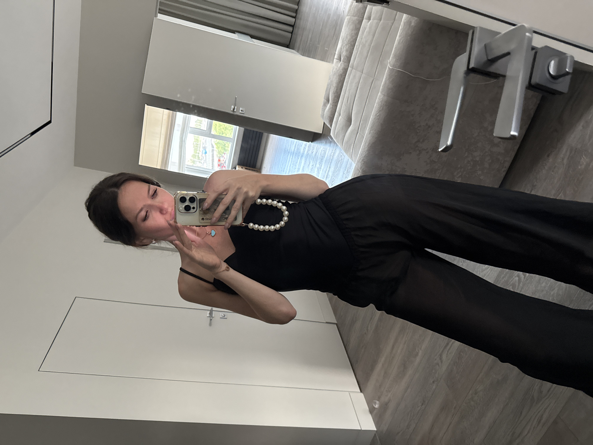 Woman takes mirror selfies in Dolgoprudny apartment