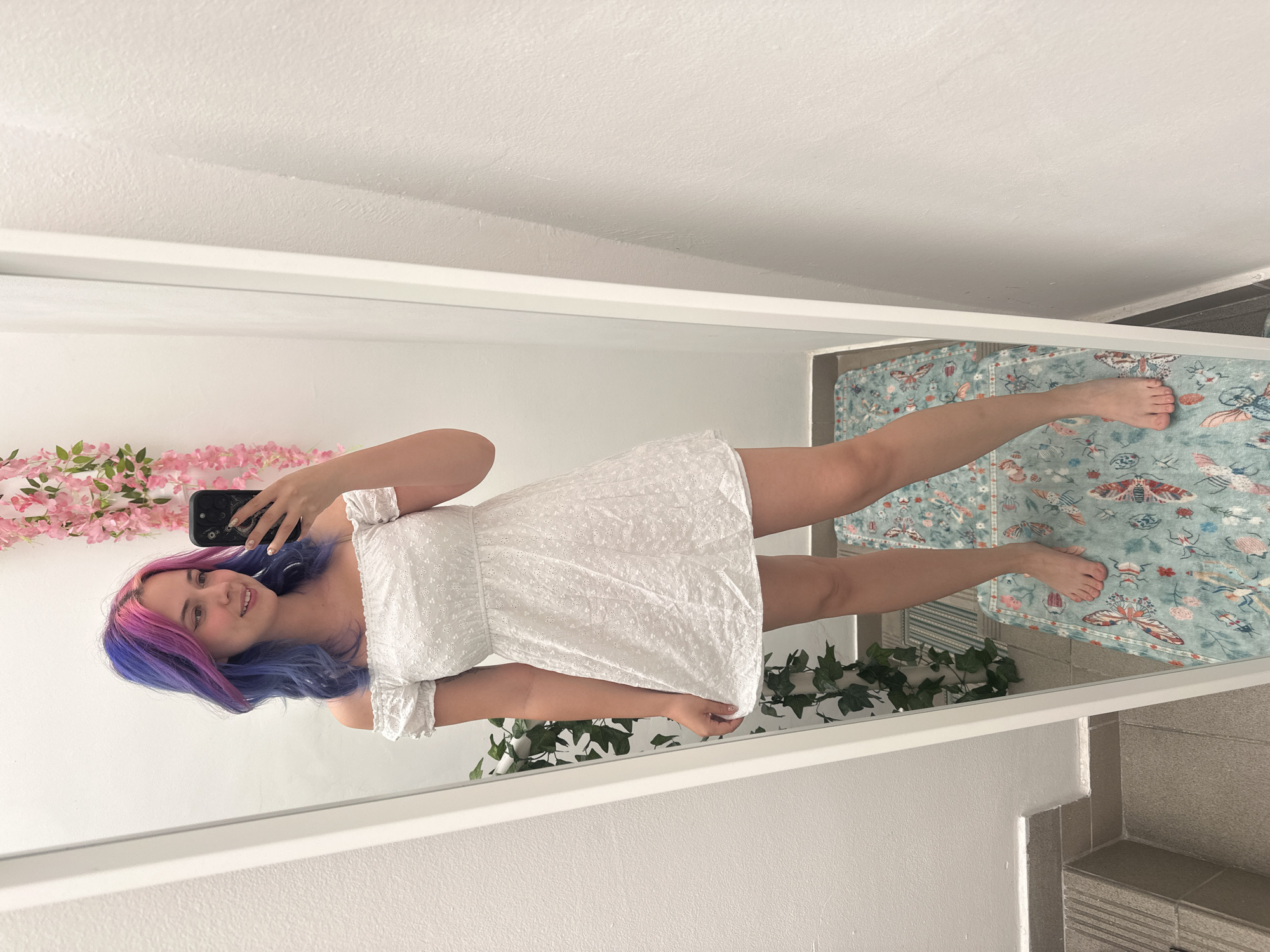 Woman takes colorful-haired mirror selfie in Zagreb