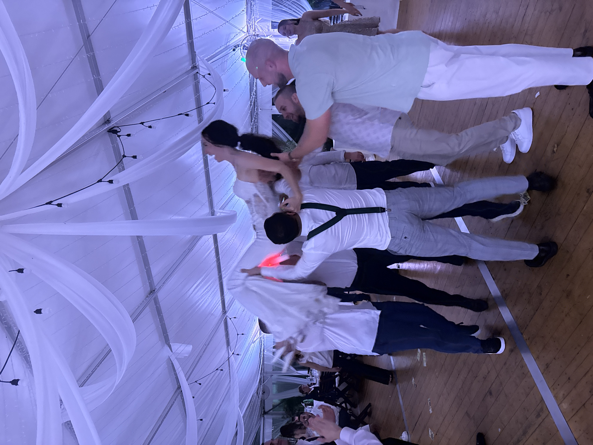 Wedding reception celebrates under tent in Perushtitsa, Bulgaria