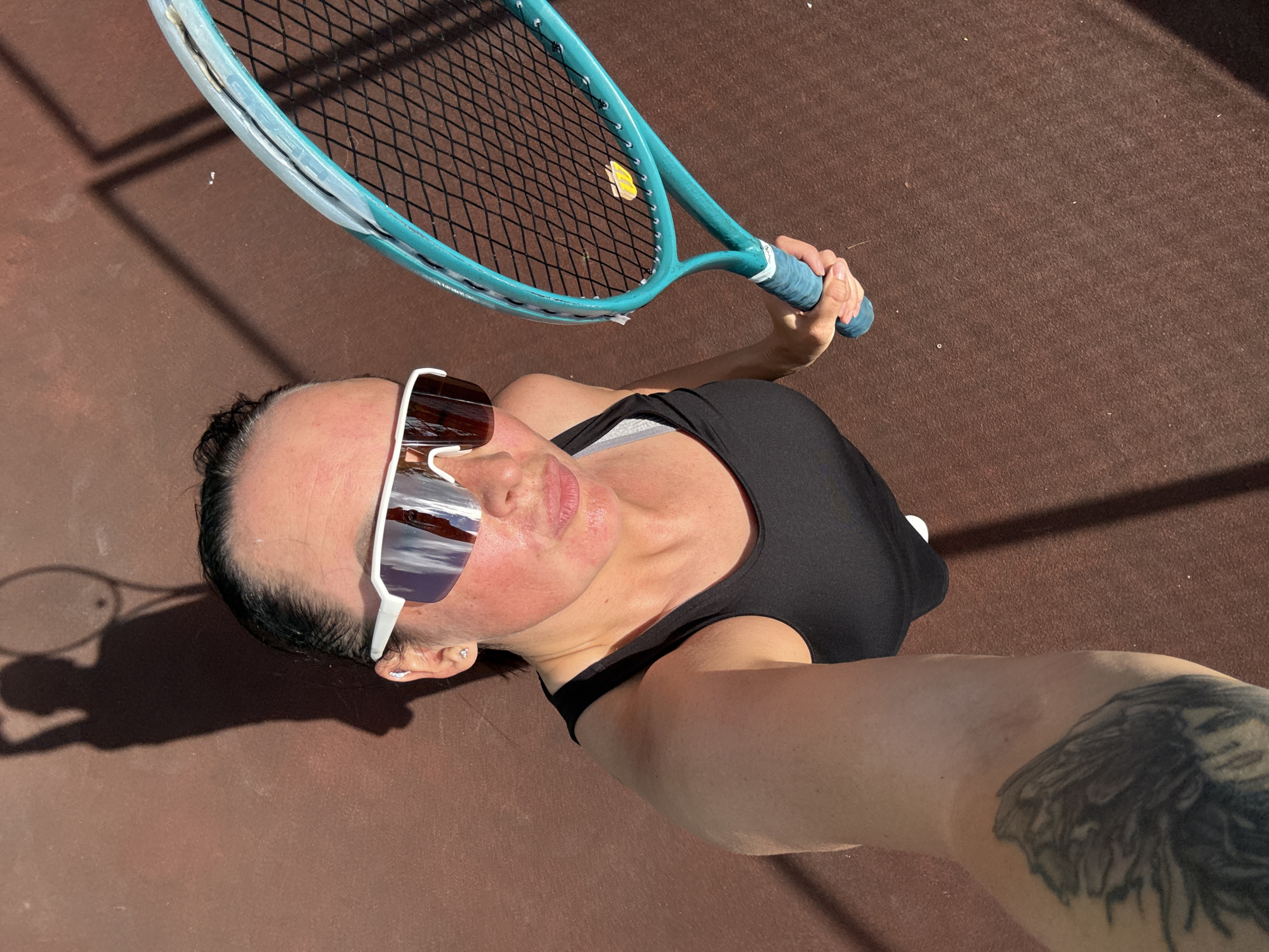 Afternoon tennis session at an outdoor court in Chaikovsky