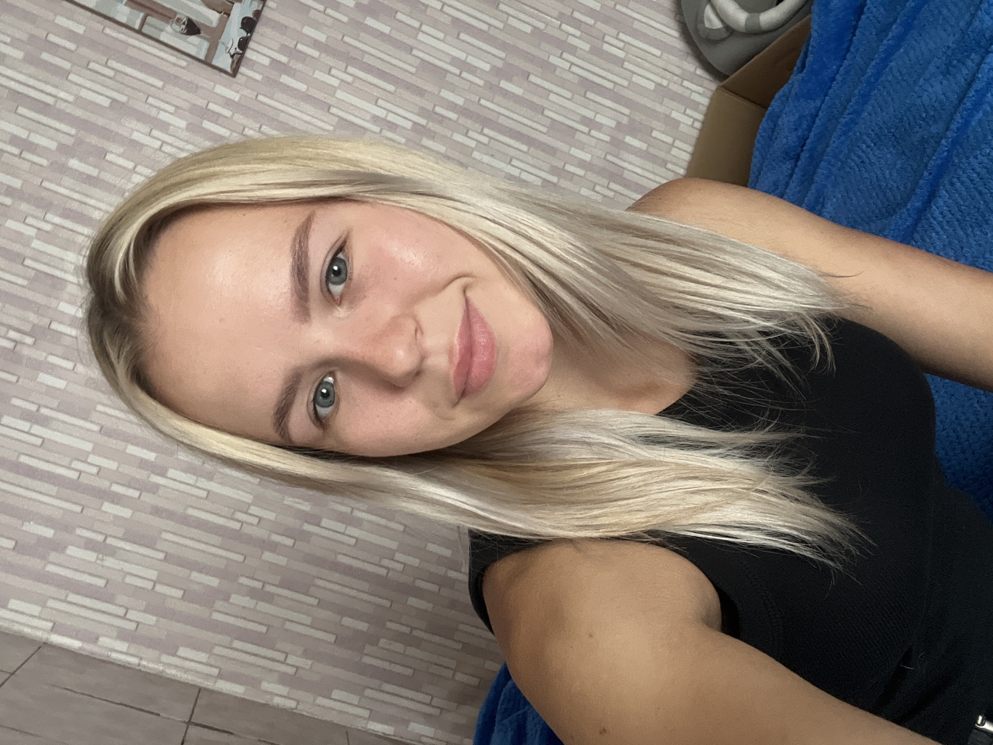Lazy morning indoors: selfies, roses, and a laptop on a blue blanket