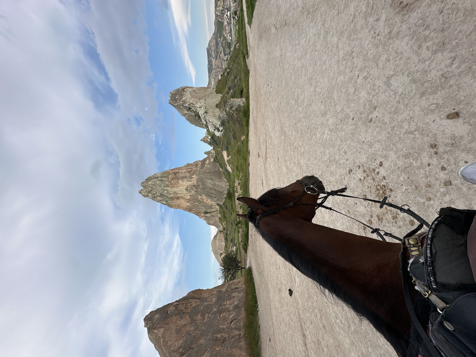 Horseback rider explores rural Avanos landscape in Turkey