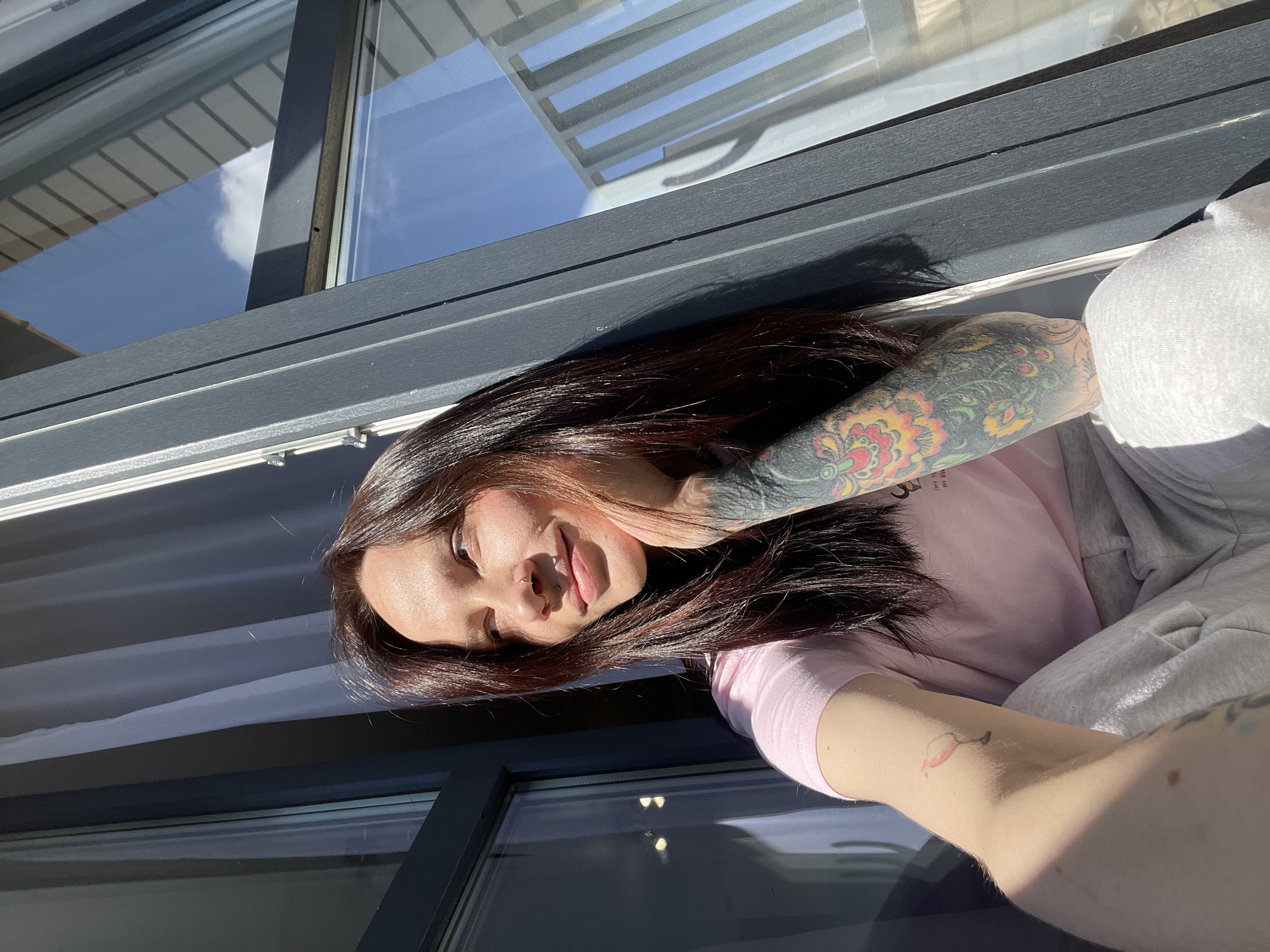 Woman photographed in sunlit indoor setting in Izhevsk