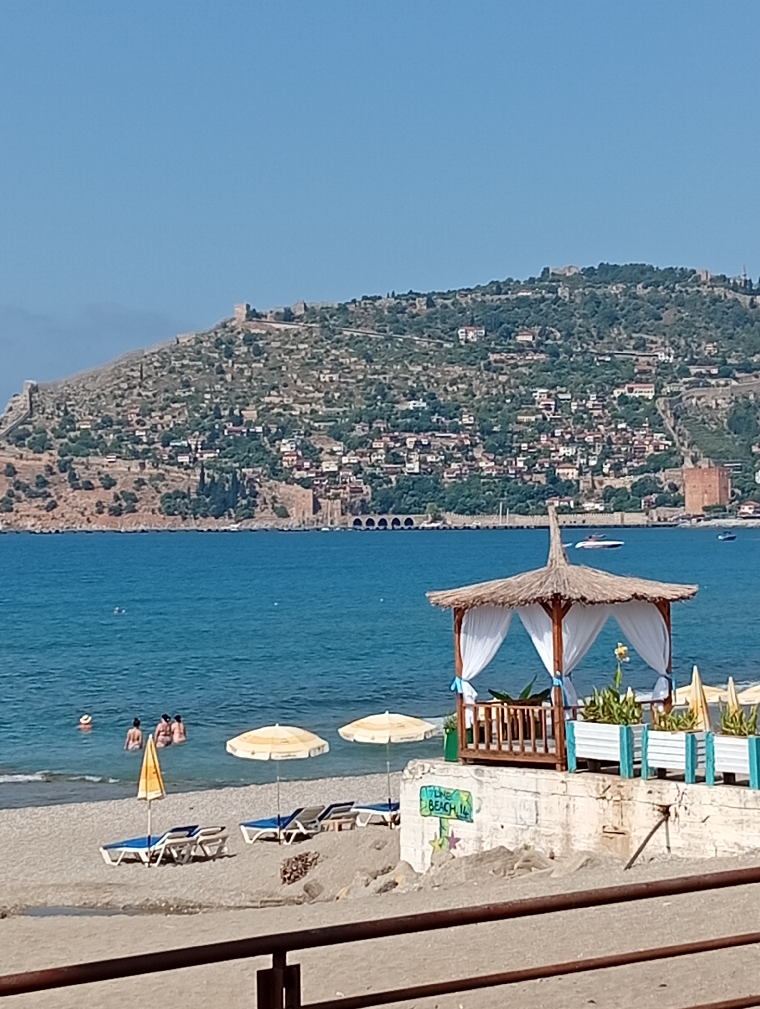 Sunny morning stroll through an Alanya coastal park and beach