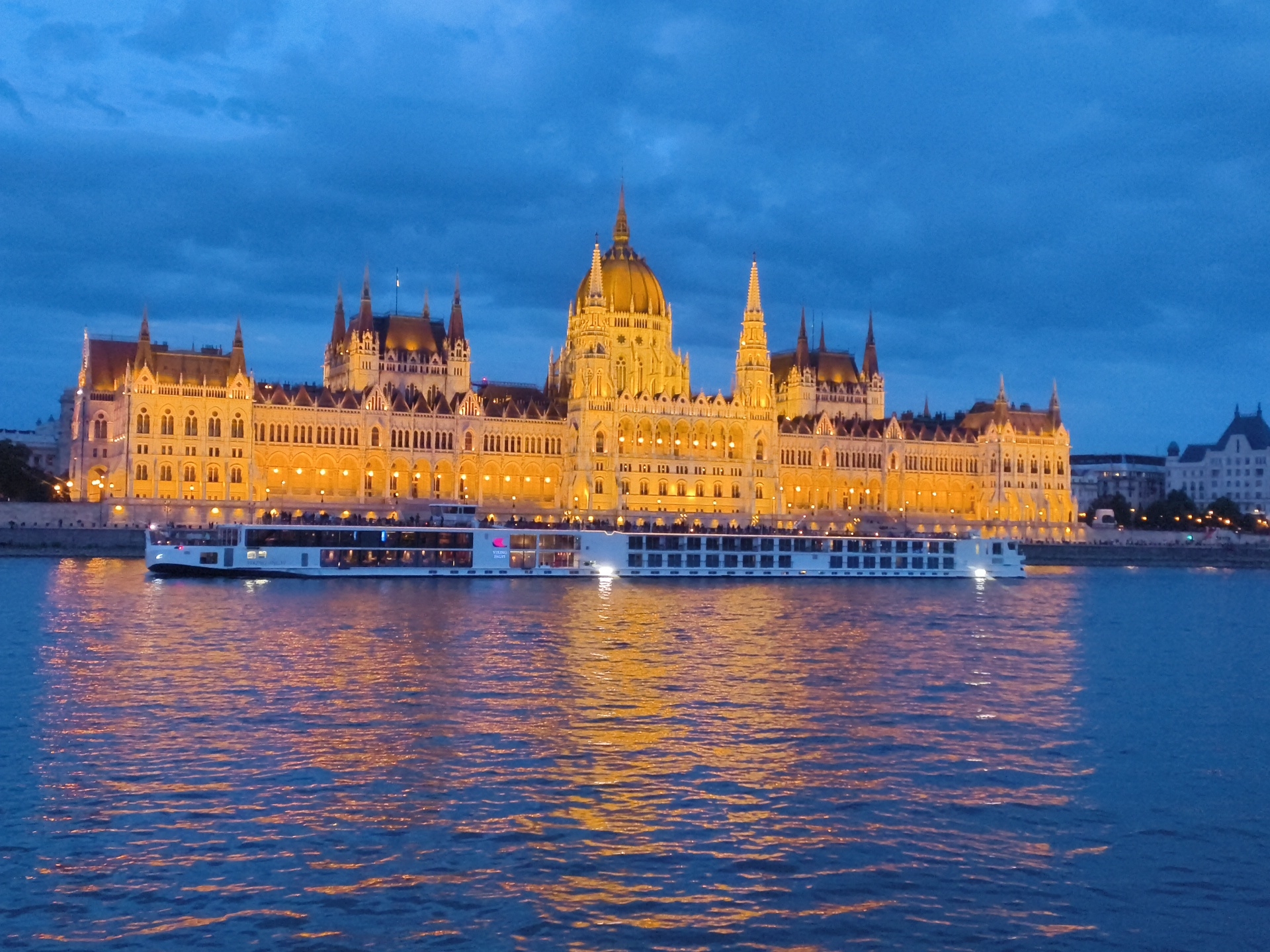 Evening documentation of illuminated Hungarian Parliament from Danube River