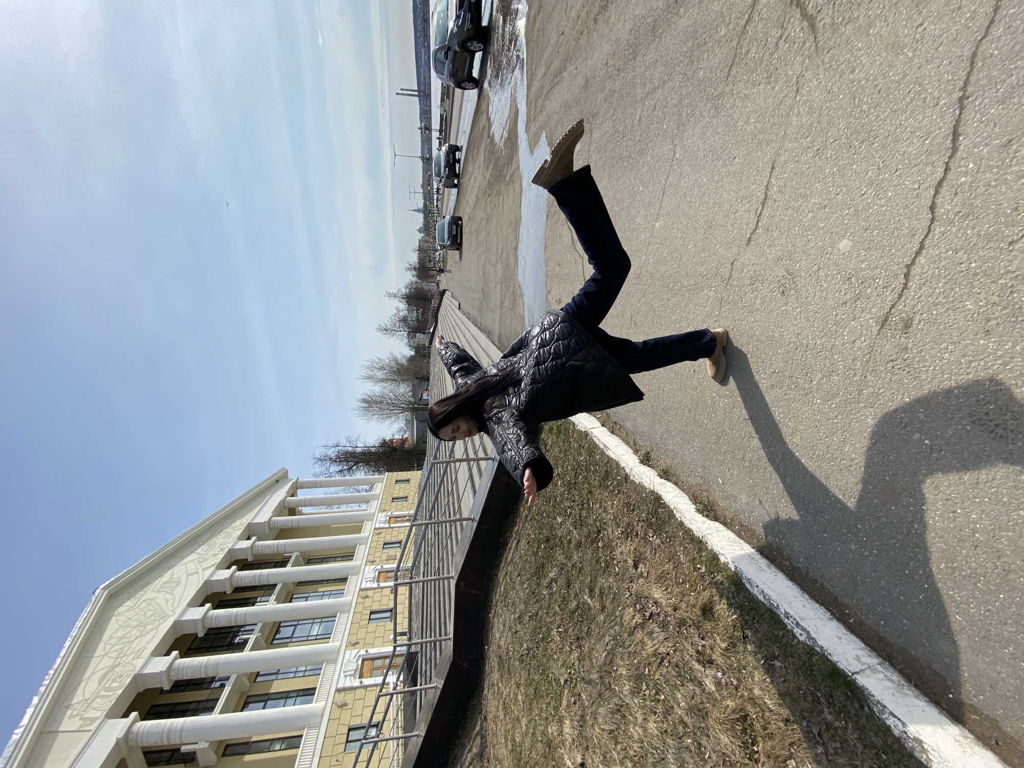 Woman photographs herself at cultural sites in Votkinsk, Russia