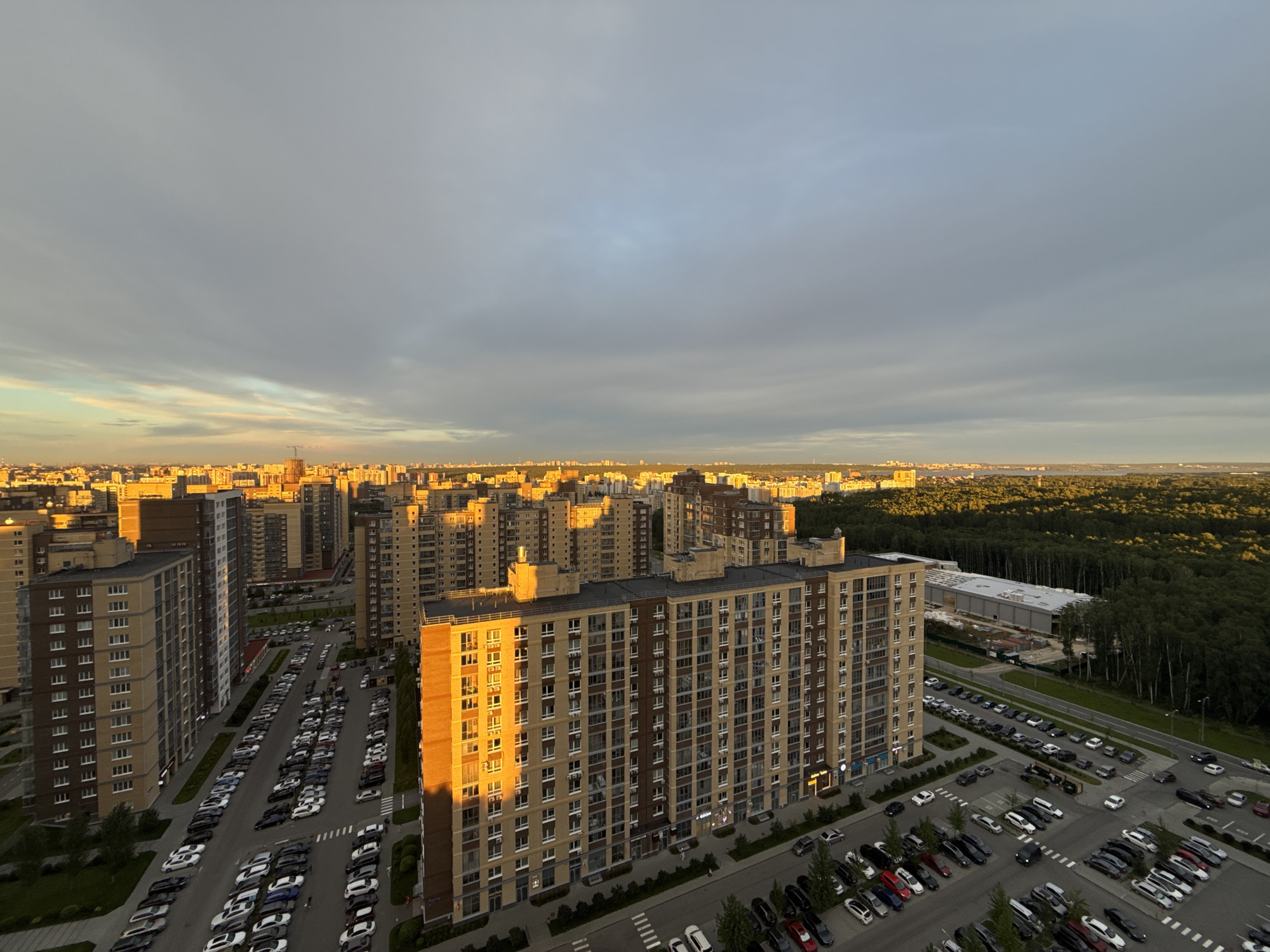 Chelyabinsk residential skyline glows at sunset from above