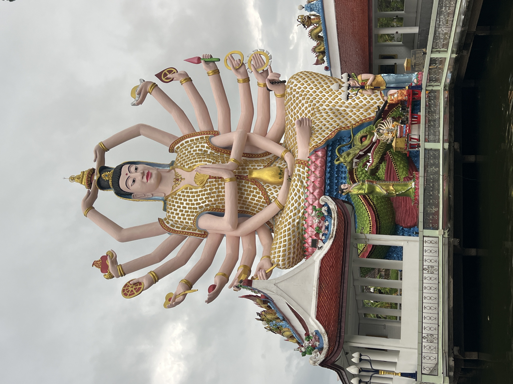 Tourist visits Wat Plai Laem temple complex in Thailand