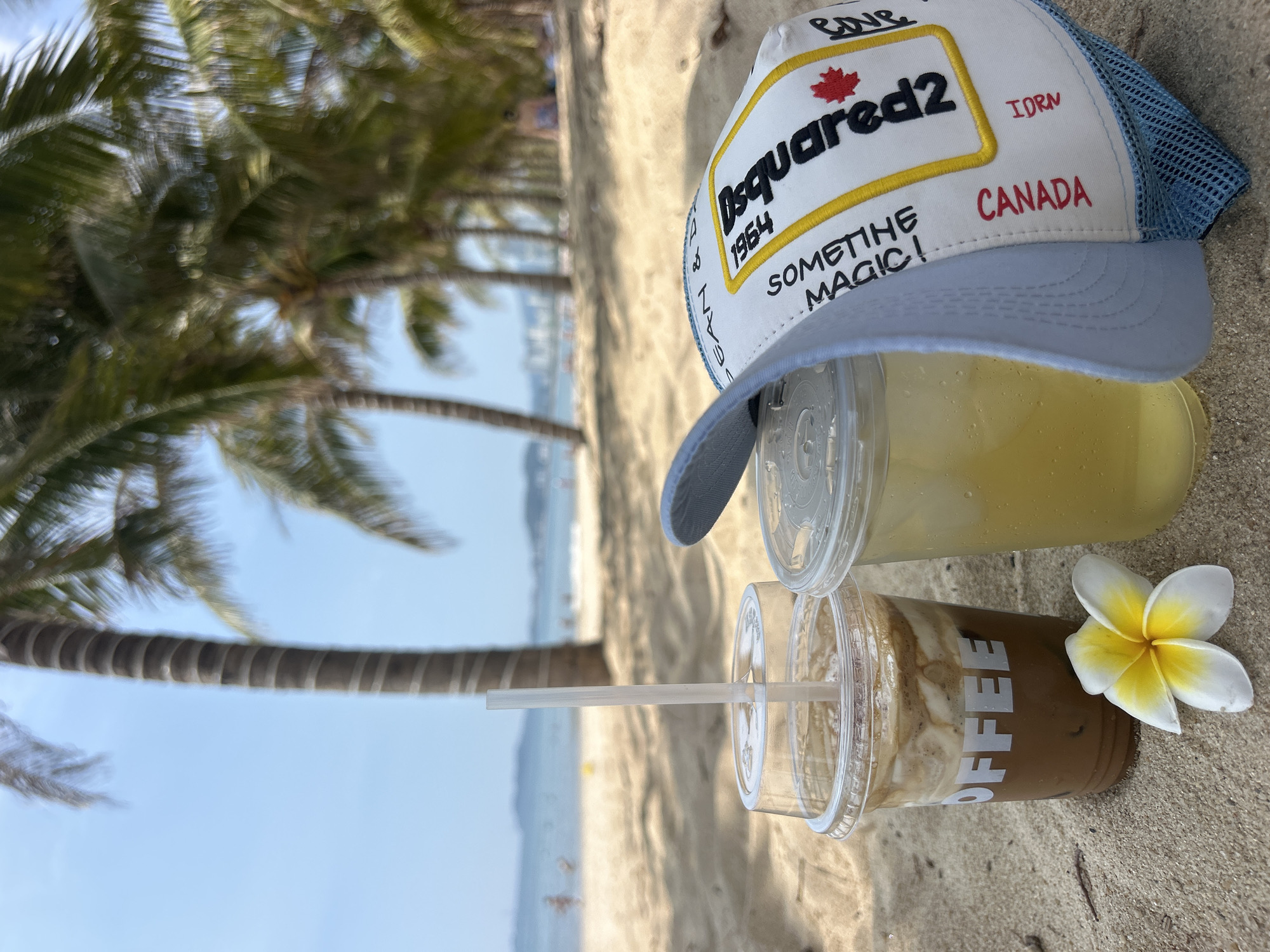 Beach visitor enjoys drinks and flowers in Nha Trang