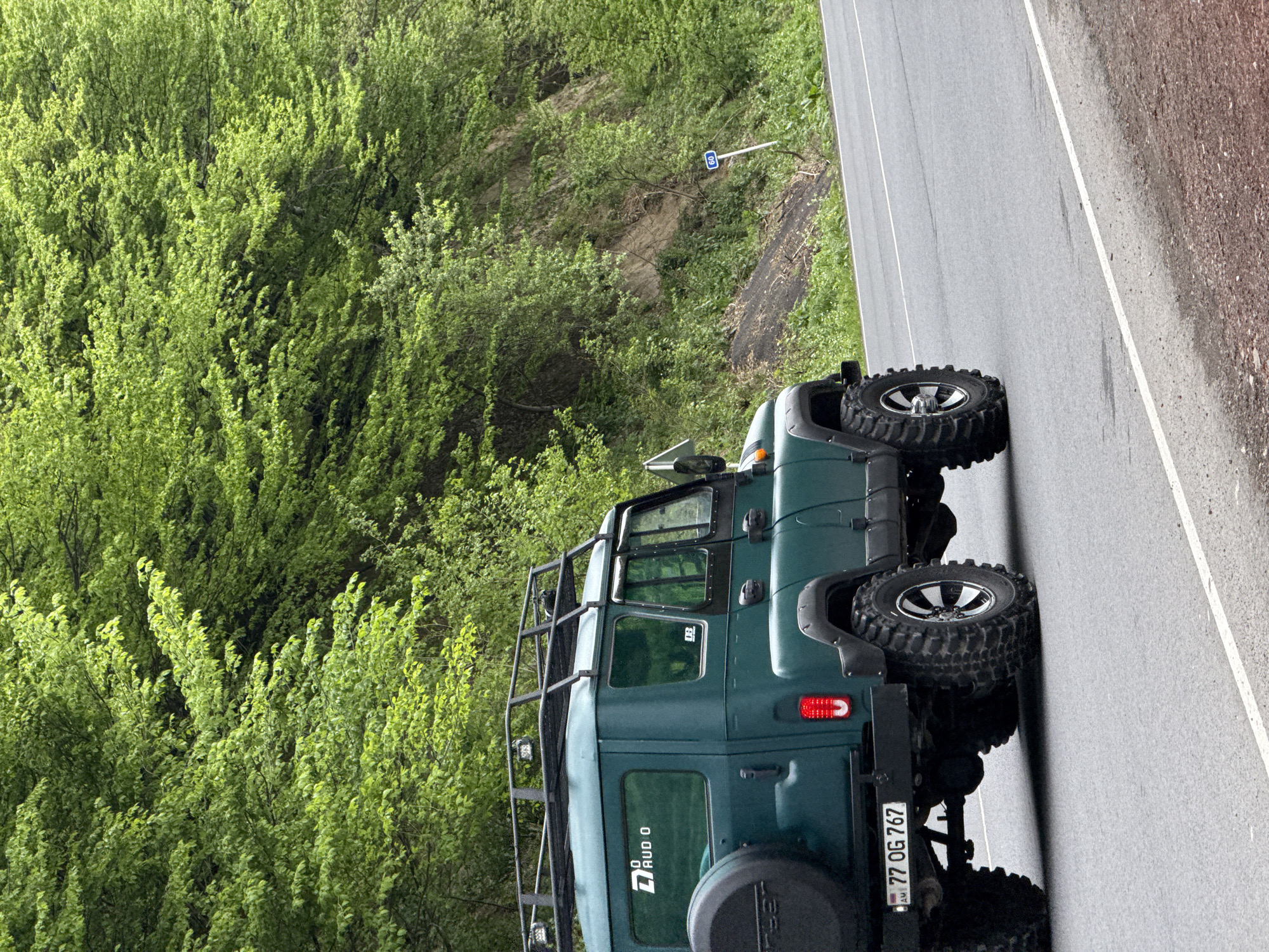 Ordinary moments captured in Dilijan: parked jeep, man eating corn