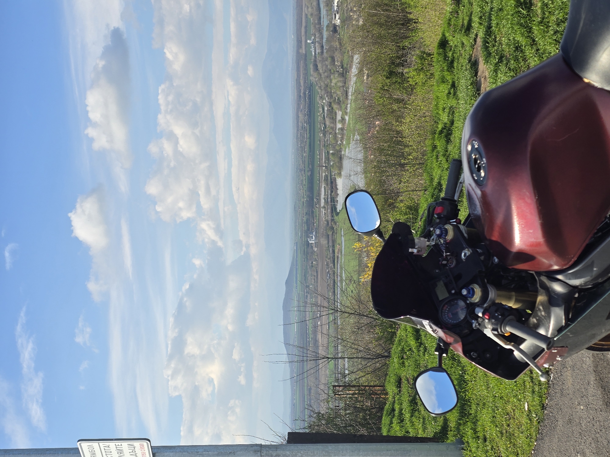 Motorcyclist documents Bulgarian flags, scenic views at Yambol memorial overlook