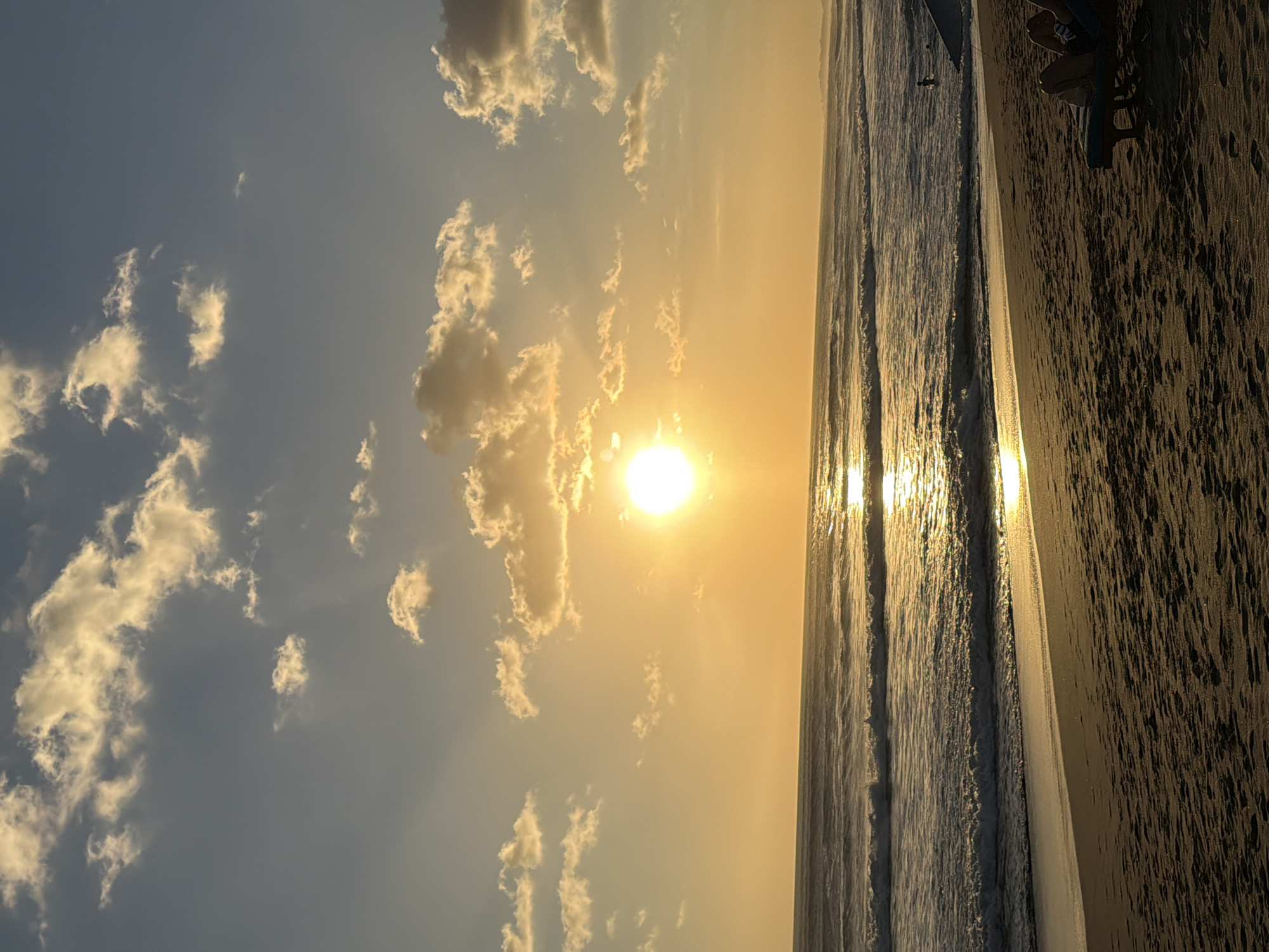 Busy Bali beach sunset, North Kuta shoreline alive with activity