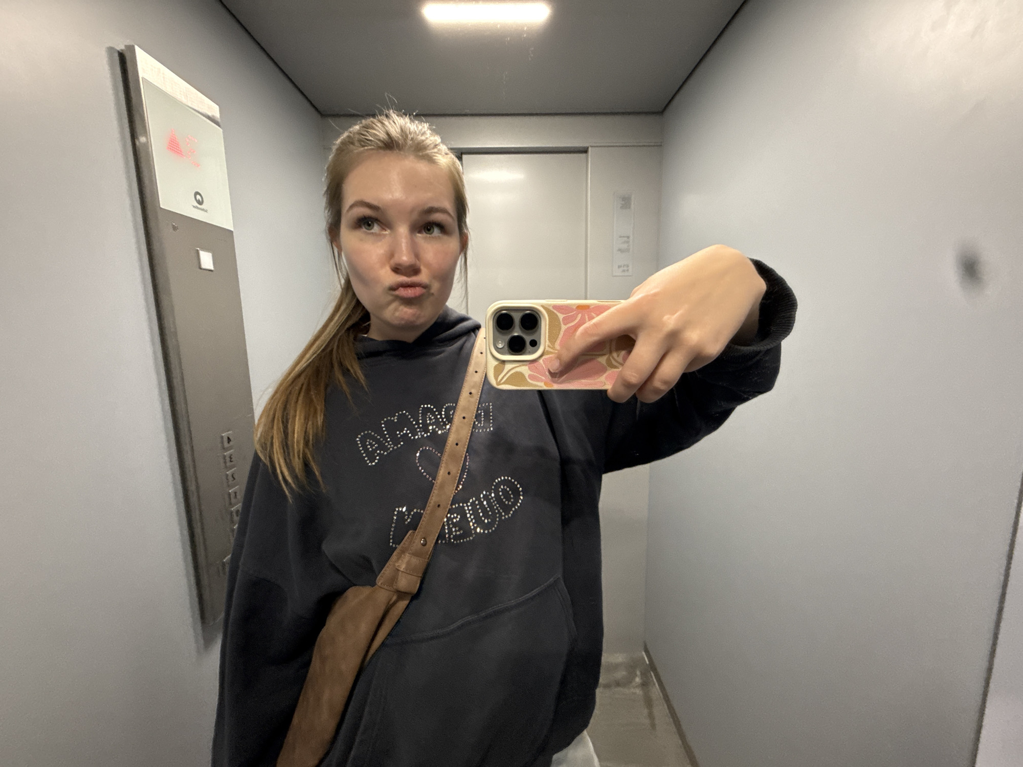 Woman takes selfies in Belgrade elevator