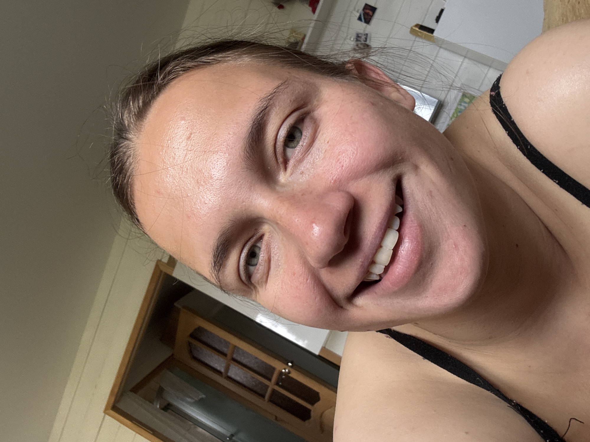 Woman takes morning selfies in Russian kitchen