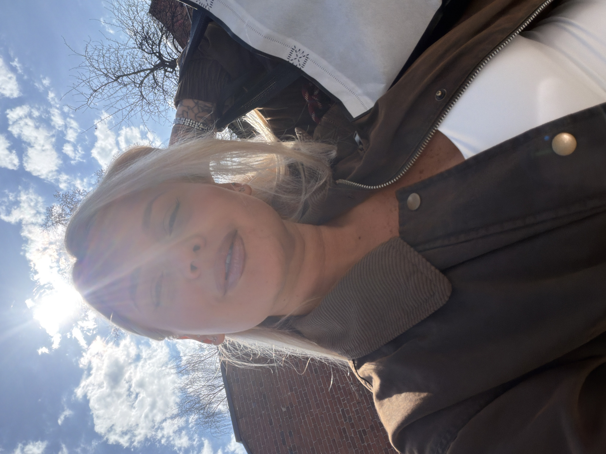 Woman takes morning selfies under clear skies in Sarapul