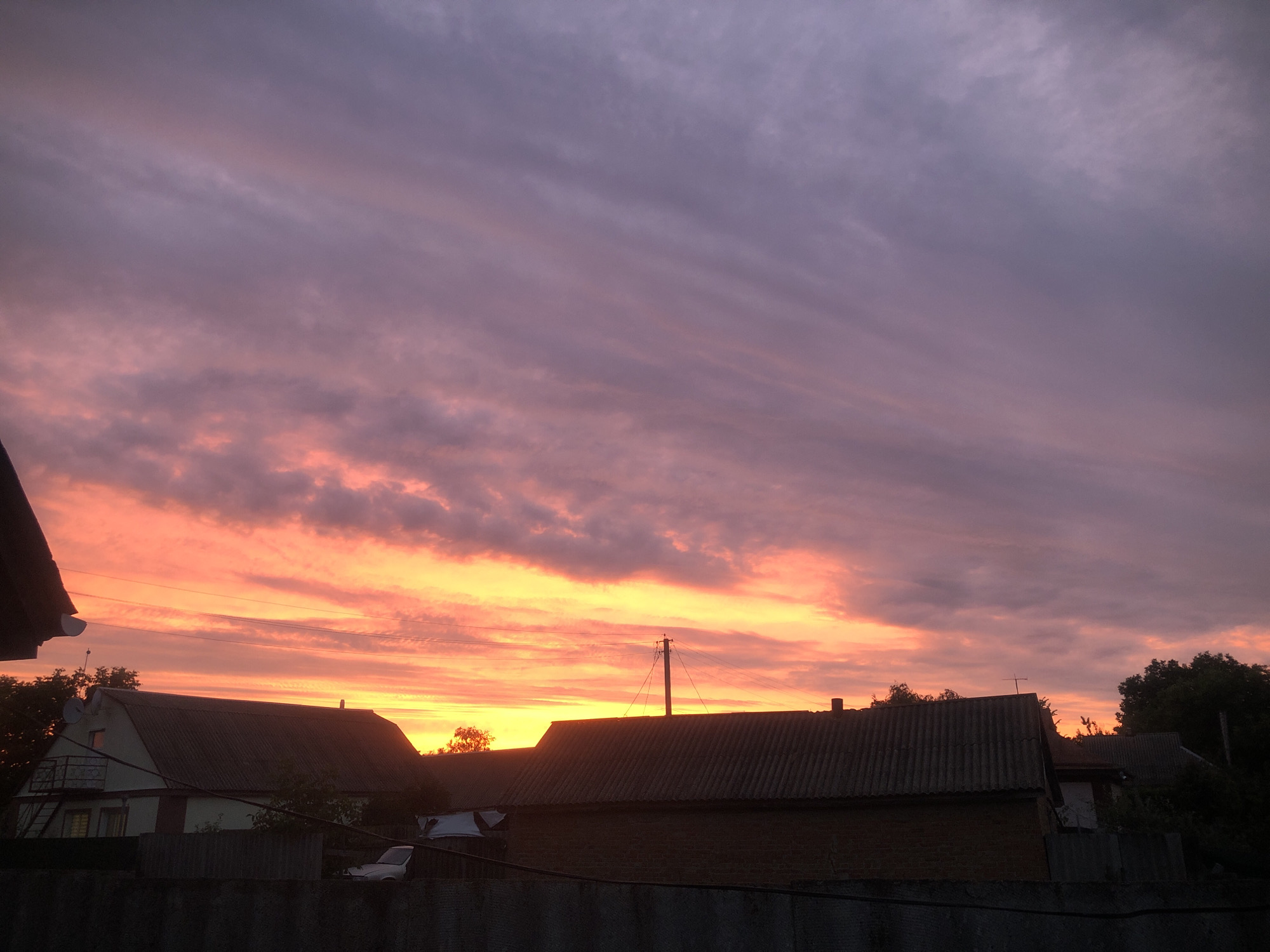 Sunset sky shifting through orange, pink, and purple