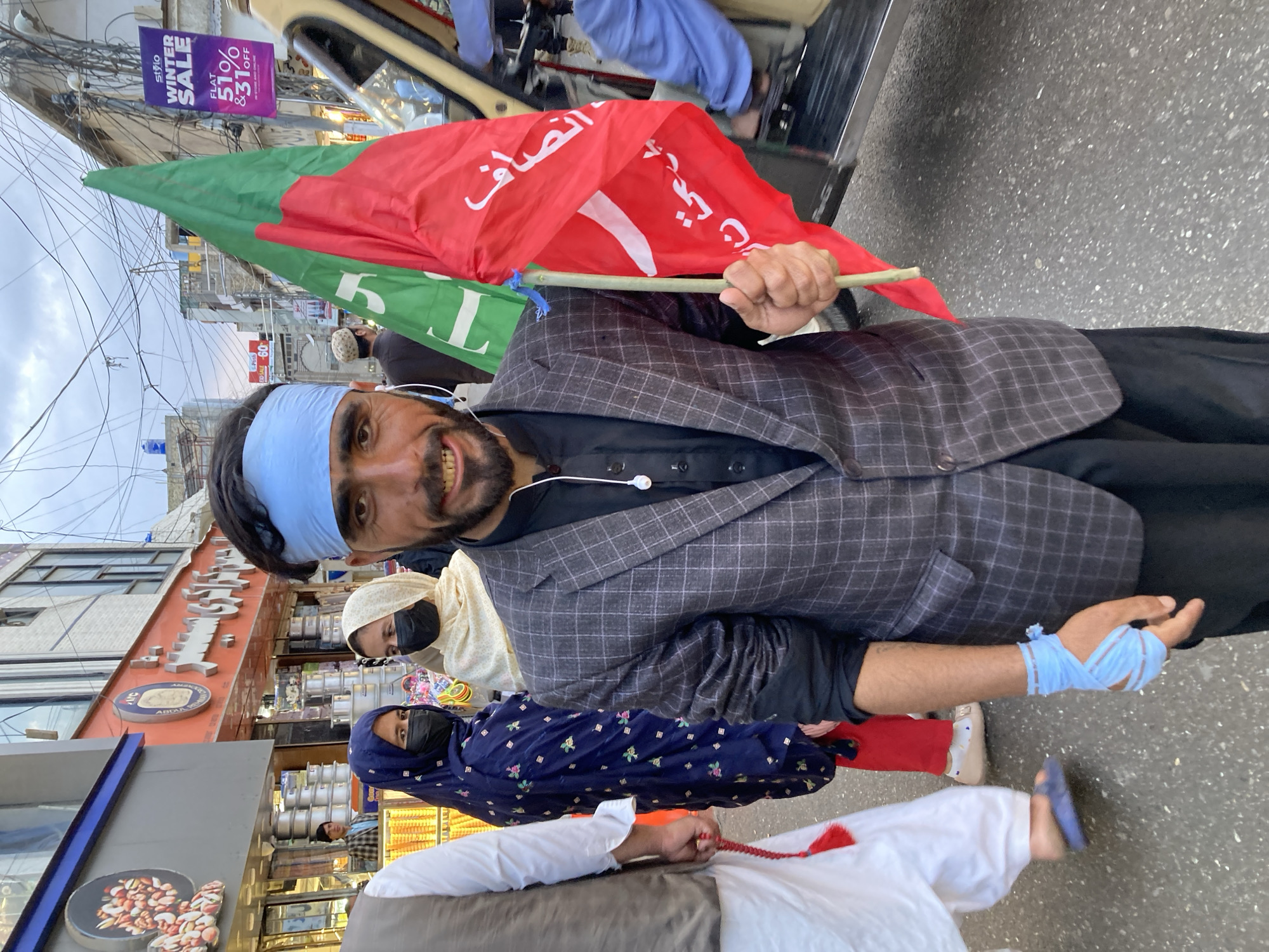 Street scenes captured across Quetta showing rest, flags, construction