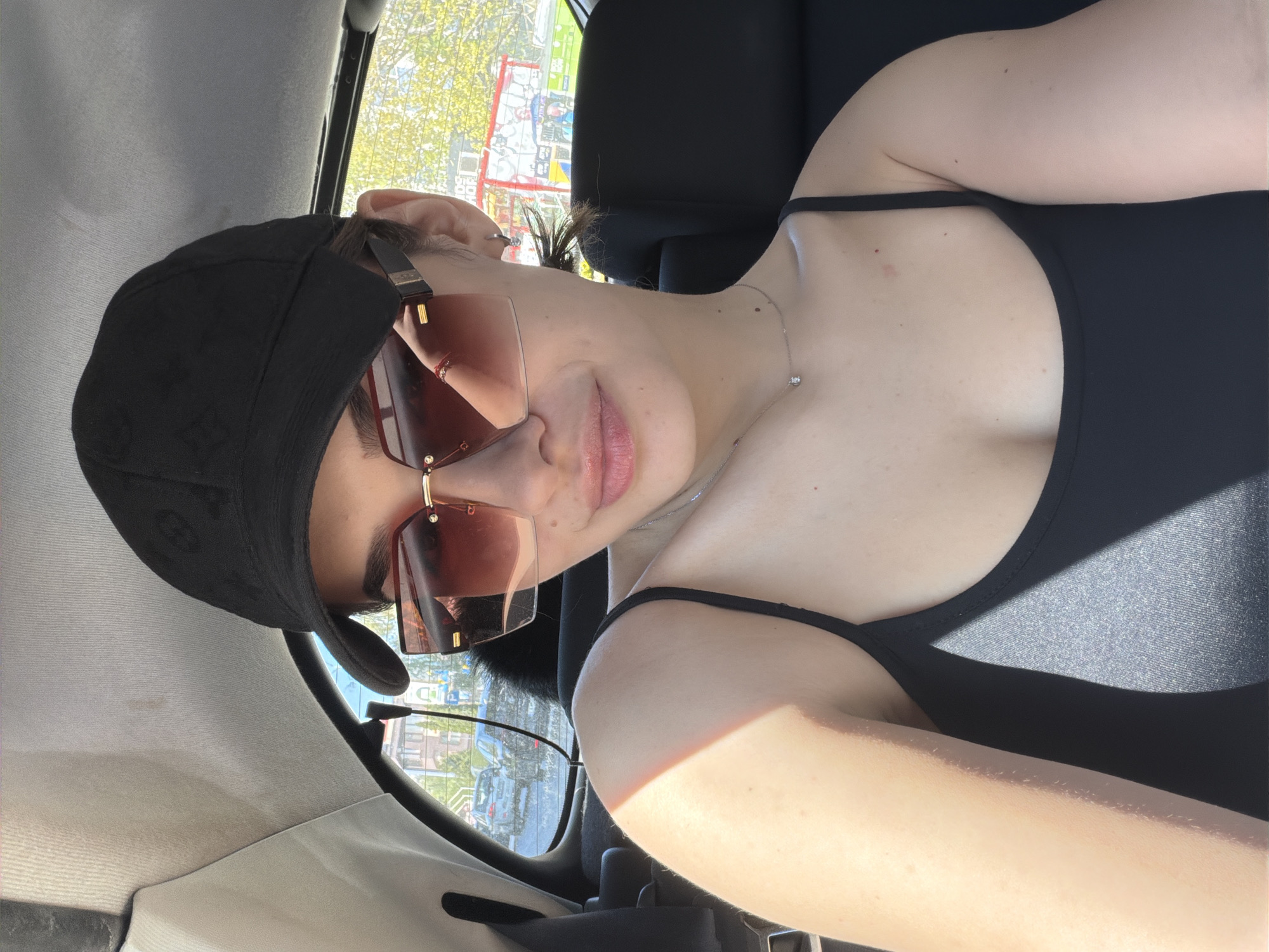 Woman poses for photos in car in Sofia