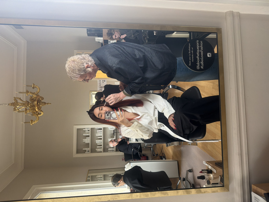Bride receives wedding prep at Paris salon near Arc de Triomphe