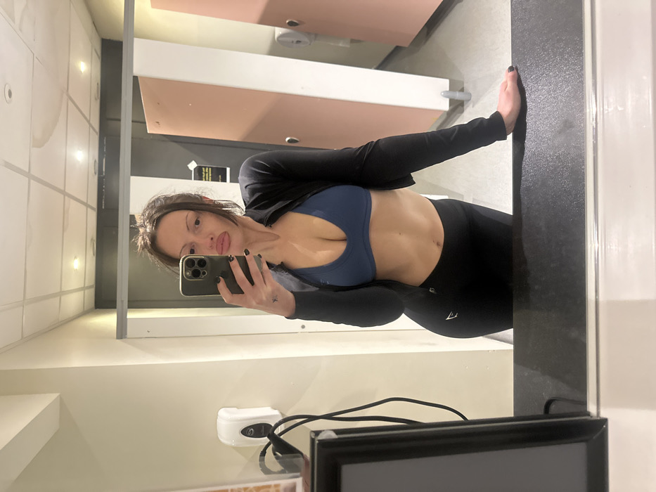 Woman documents gym workout session in Kent fitness facility