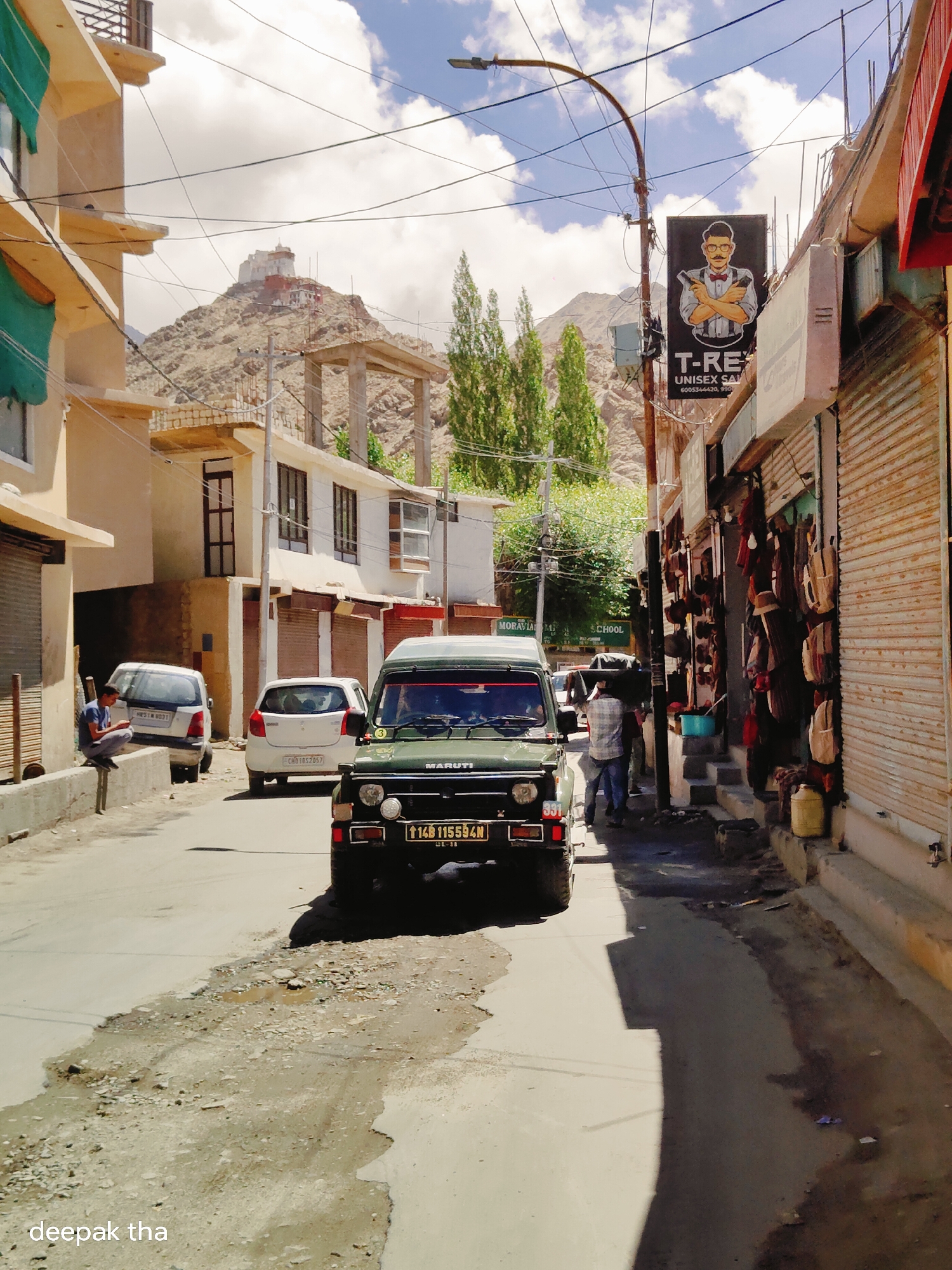 Early morning street life along a Leh commercial strip