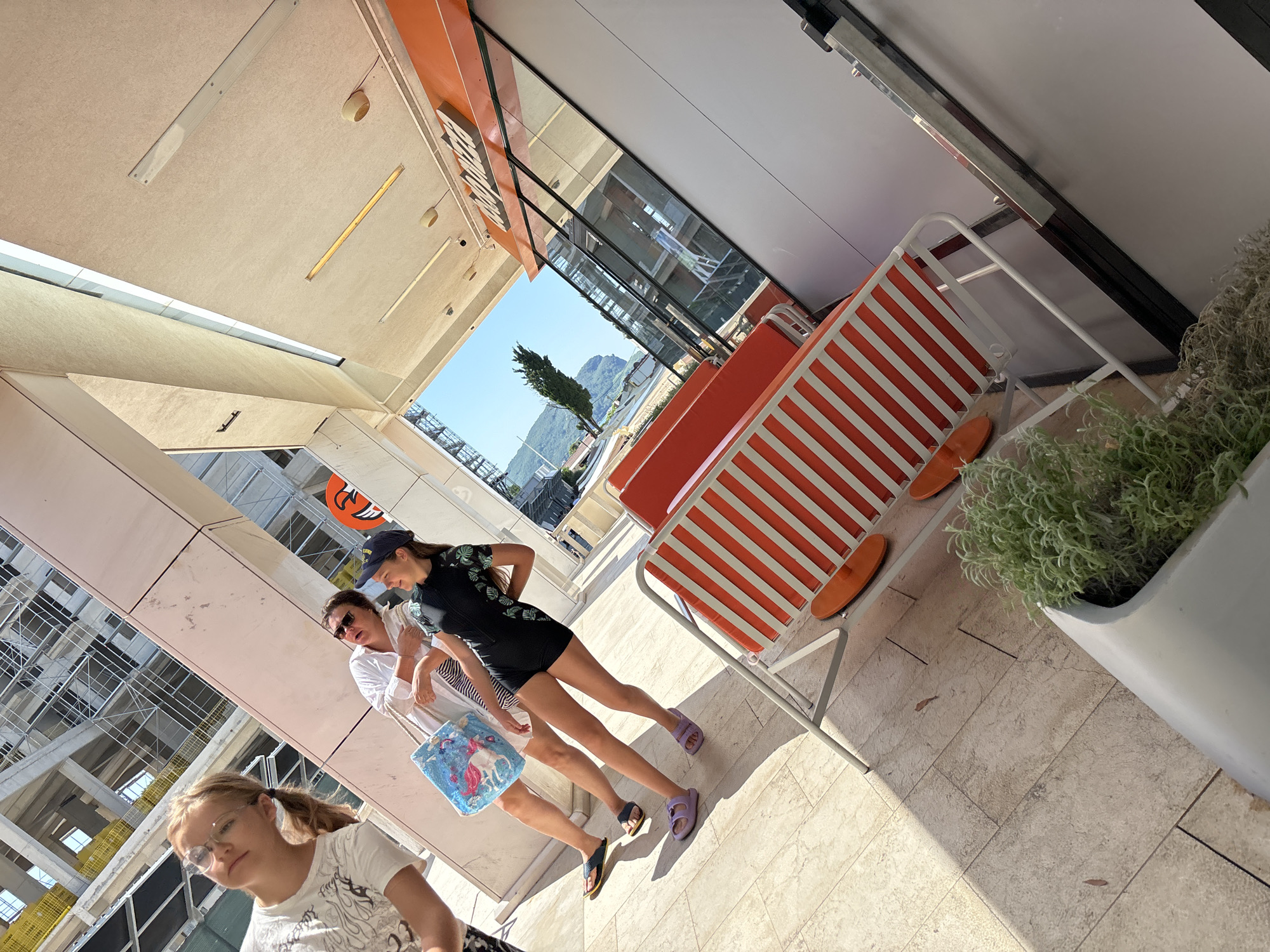 Busy summer morning along Budva's beach and old town streets