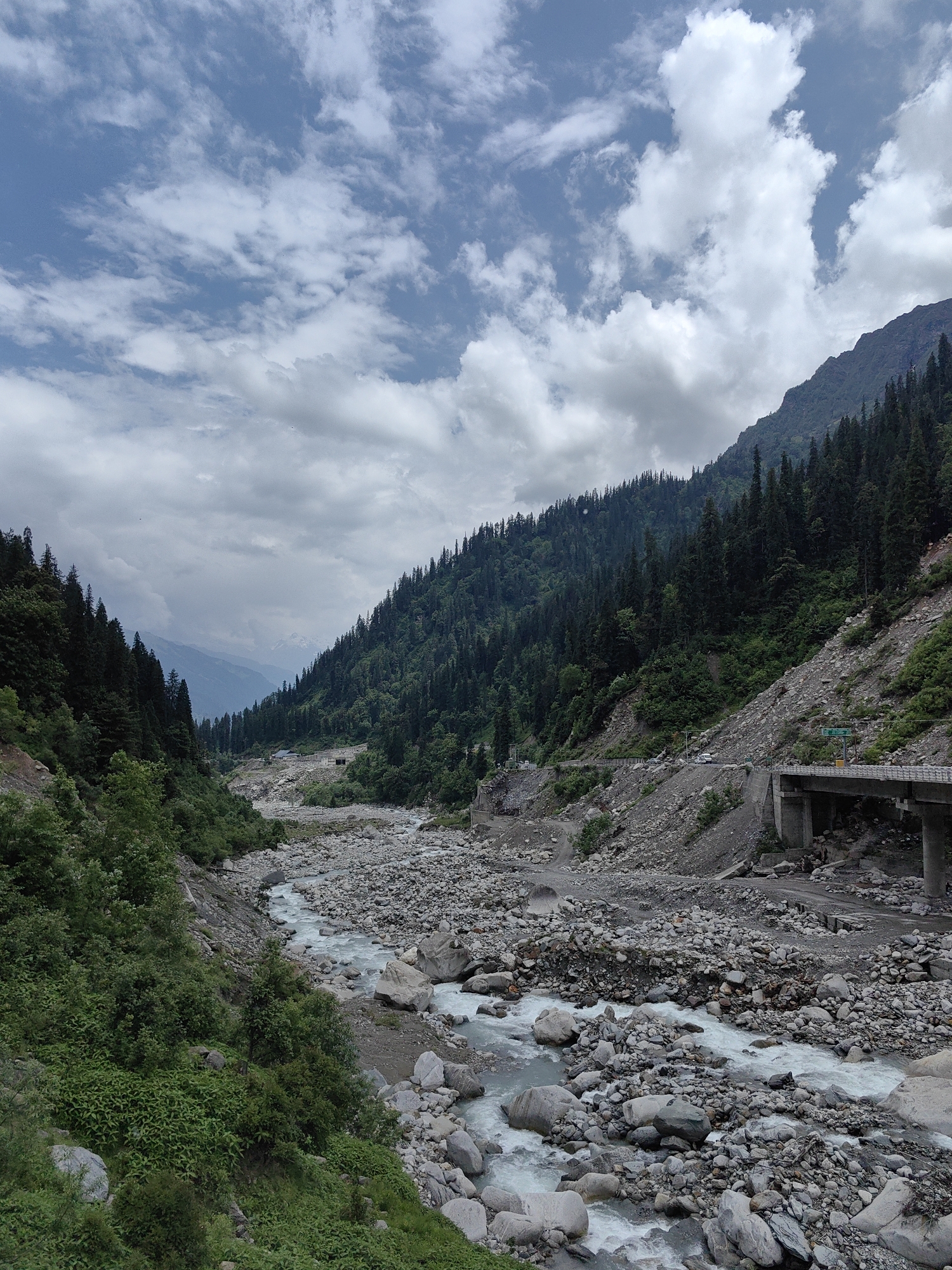 Rocky river valley and mountain road near Dhundi, Himachal Pradesh