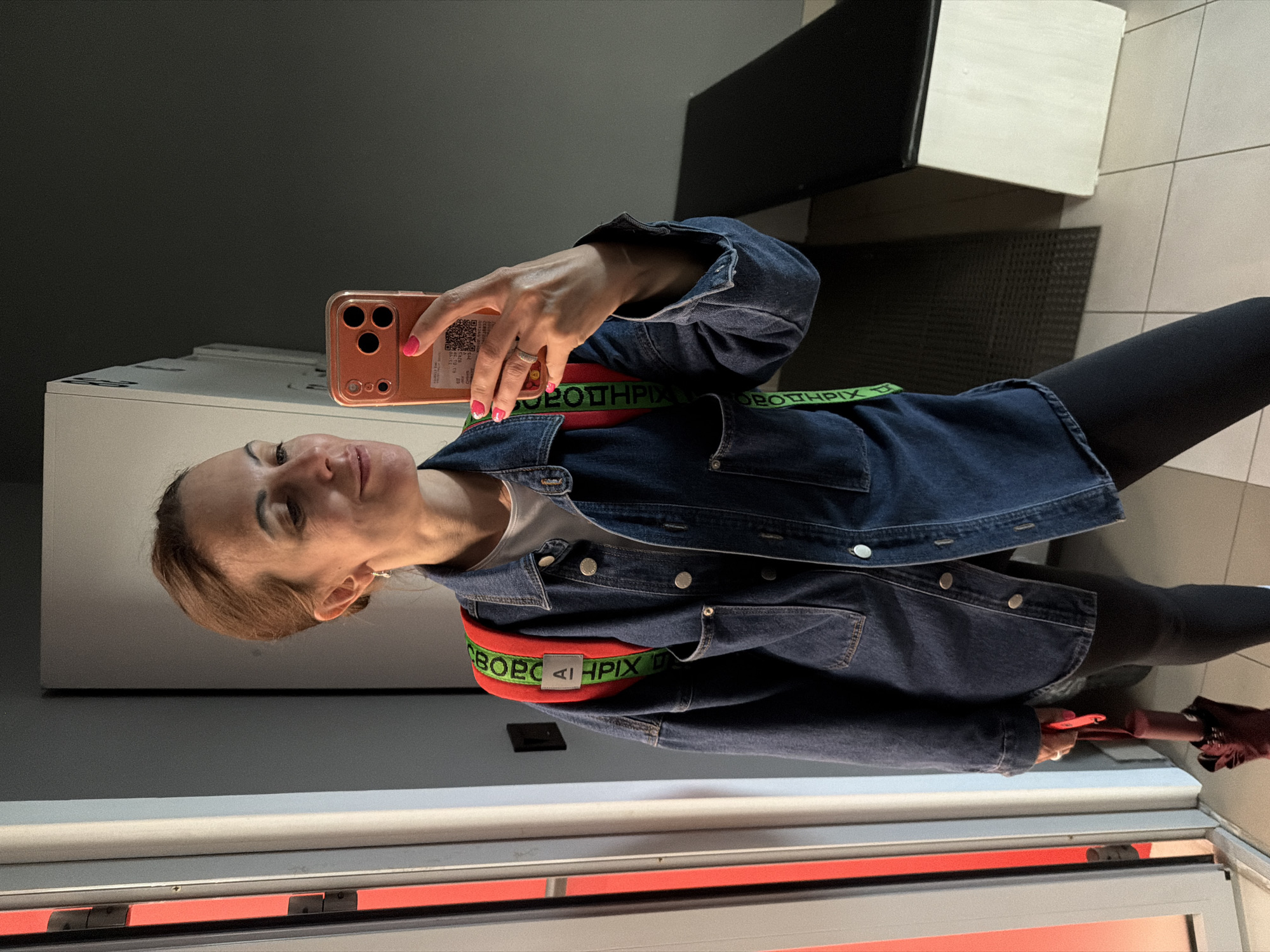 Mirror selfie in a Birobidzhan locker room, July 2026