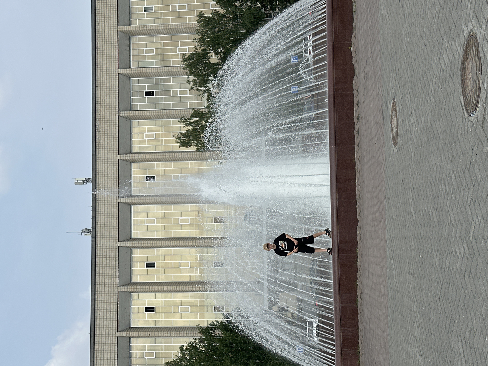 Novosibirsk plaza fountain and public art on a summer morning