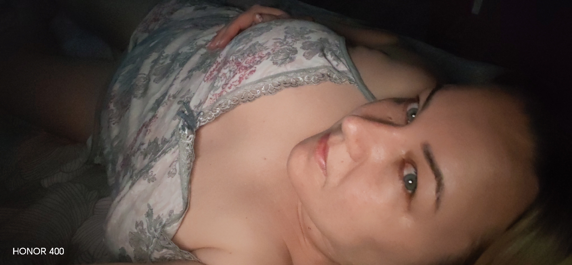 Woman photographed resting at home with pet dog in Russia