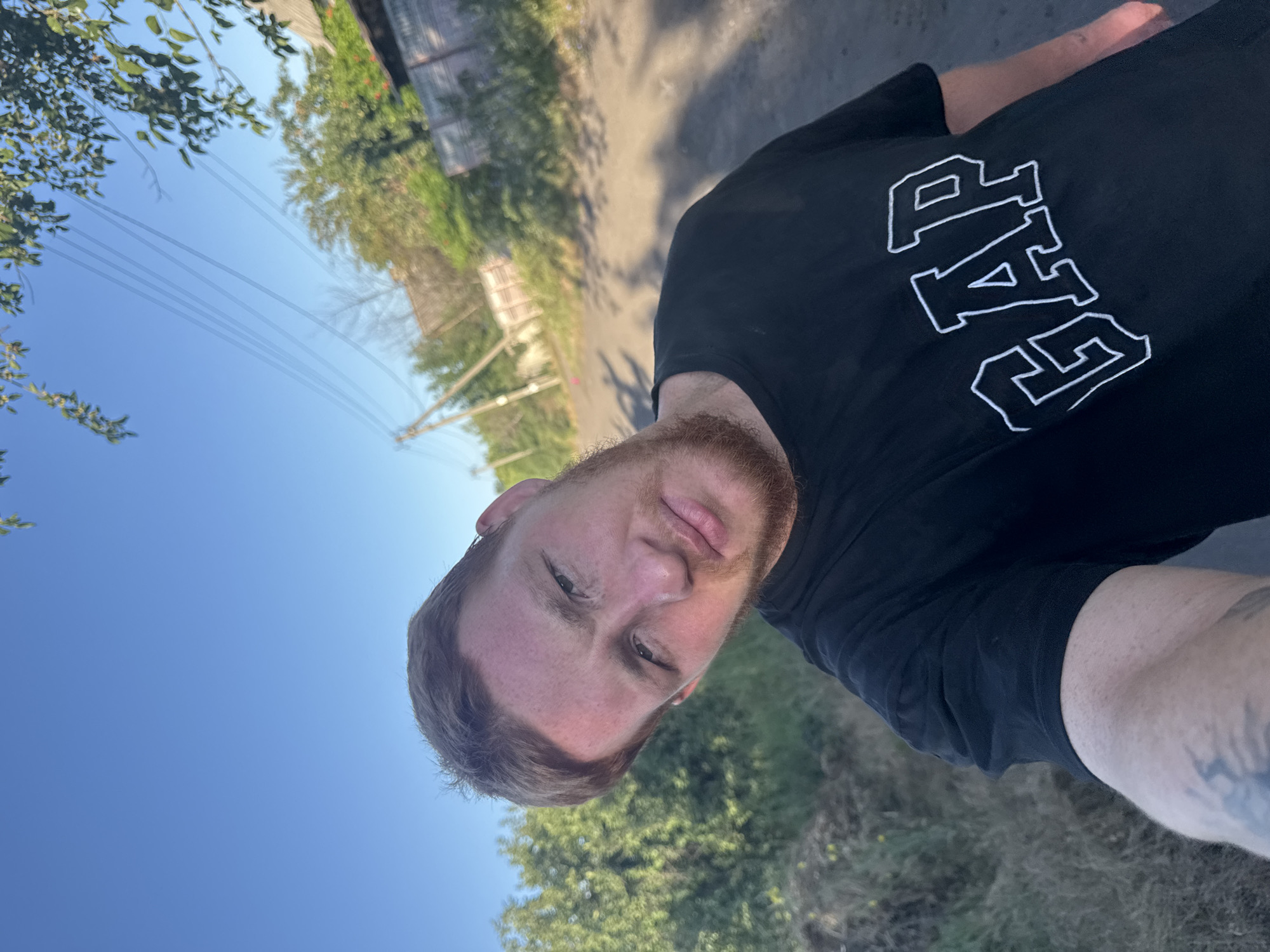 Multiple selfie angles, black GAP tee, outdoor dirt road setting
