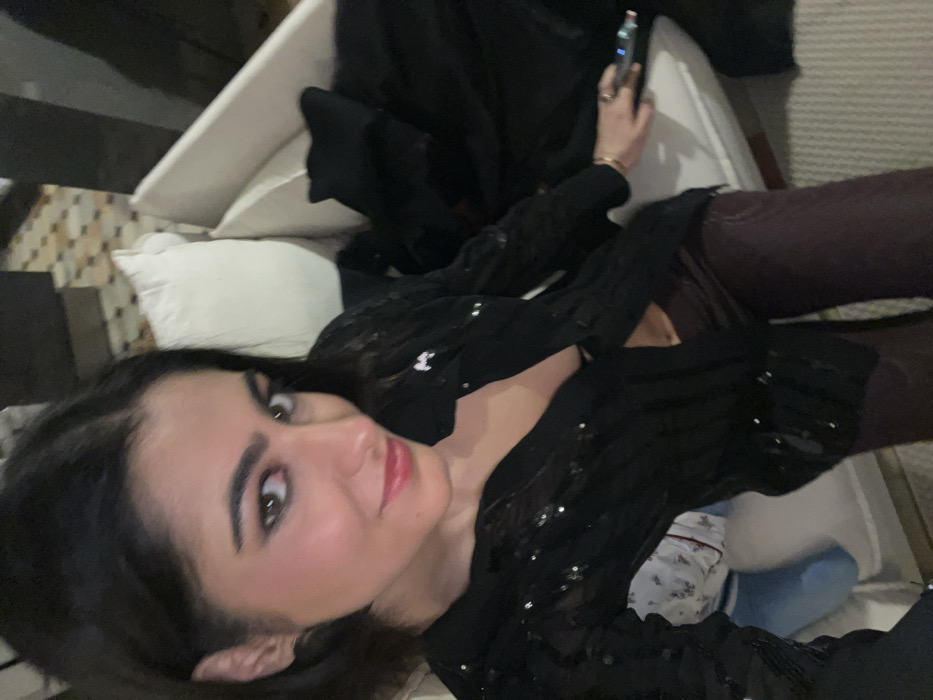 Woman poses for multiple photos in Paris apartment