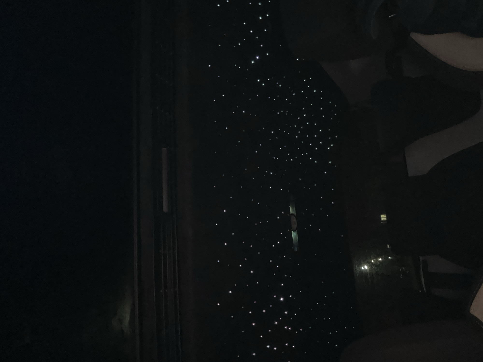 Nighttime moments captured in Berkovitsa: car interior, orange cat, starlit ceiling