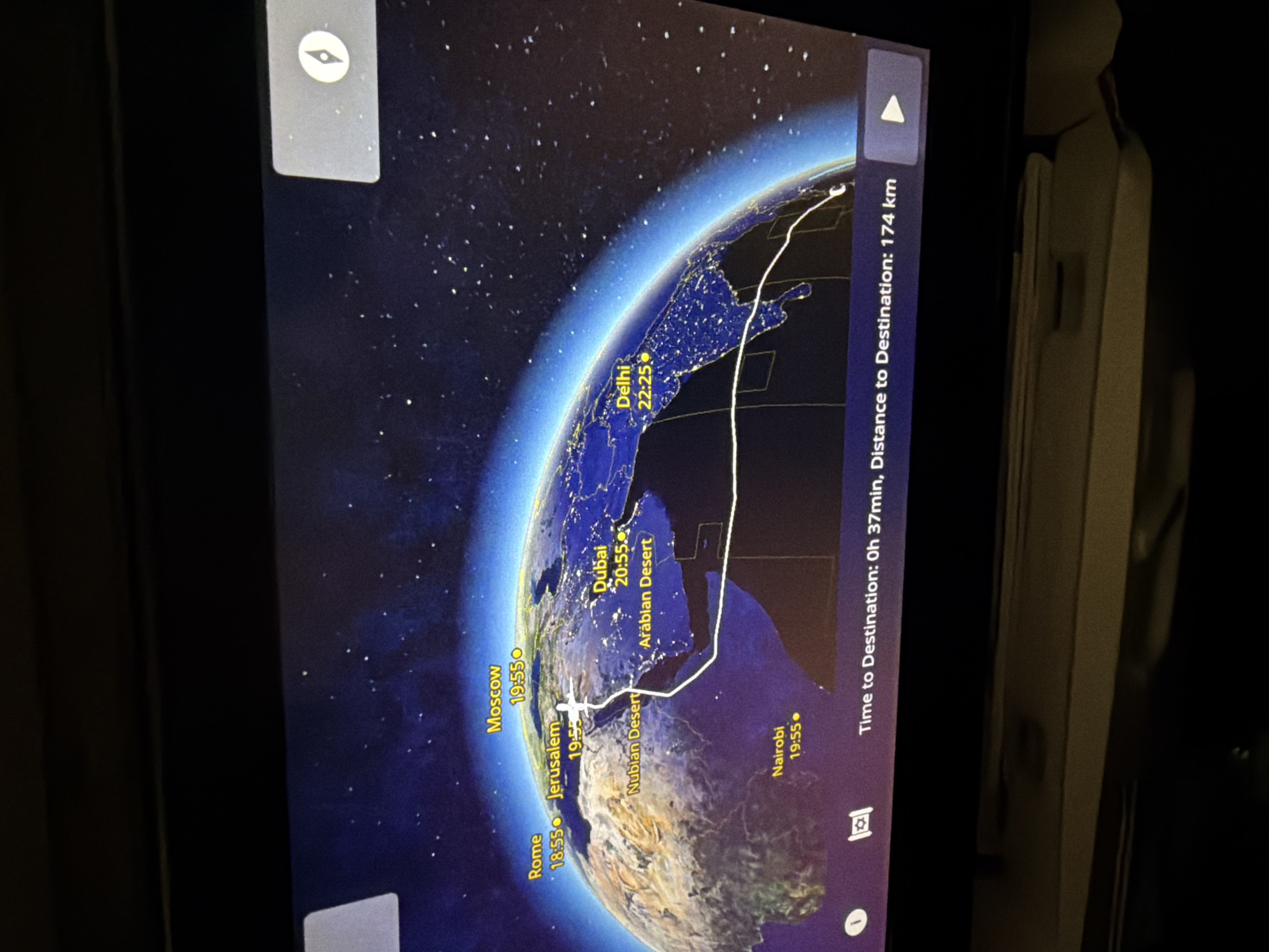 Passenger captures in-flight map showing Earth from space view