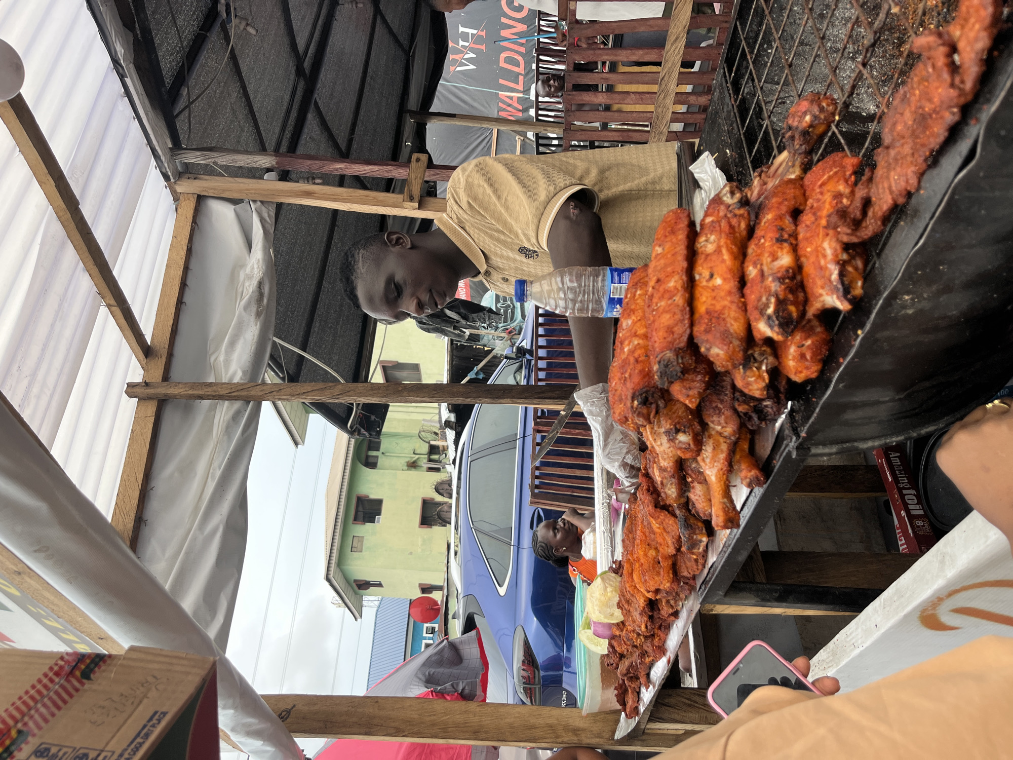 Street food vendors serve customers in Ado, Nigeria