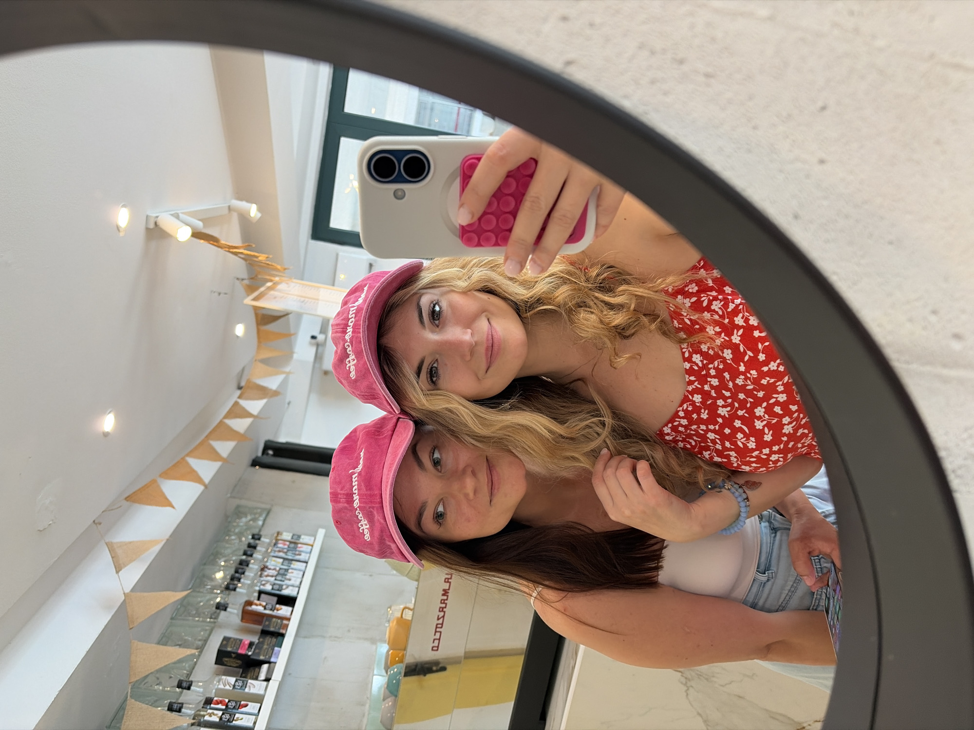 Women enjoy casual moments reading, eating chocolate in Budva